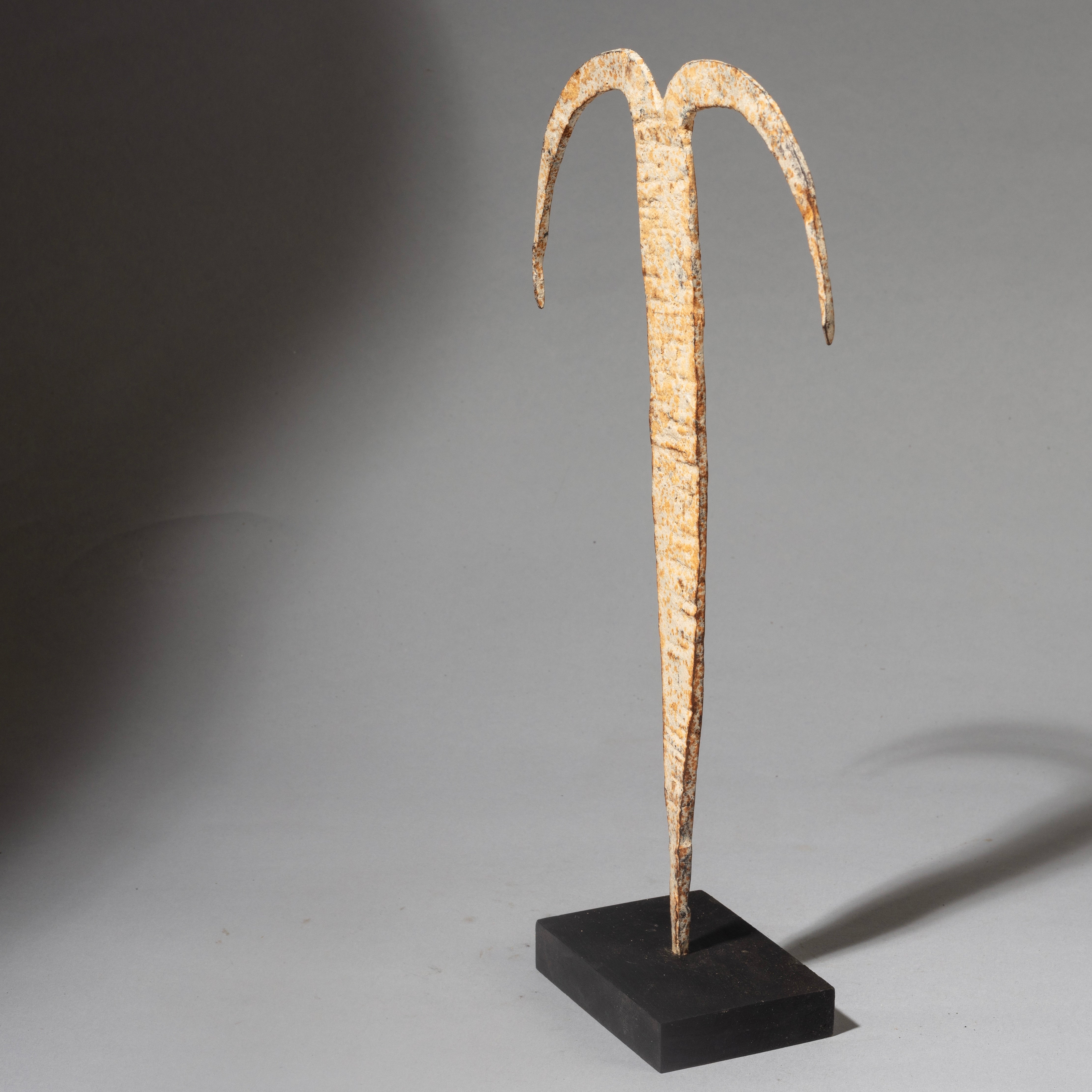 A PIGMENT ENCRUSTED IRON CRESCENT MOON FETISH FROM THE EWE TRIBE OF GHANA W.AFRICA ( No 4505 )