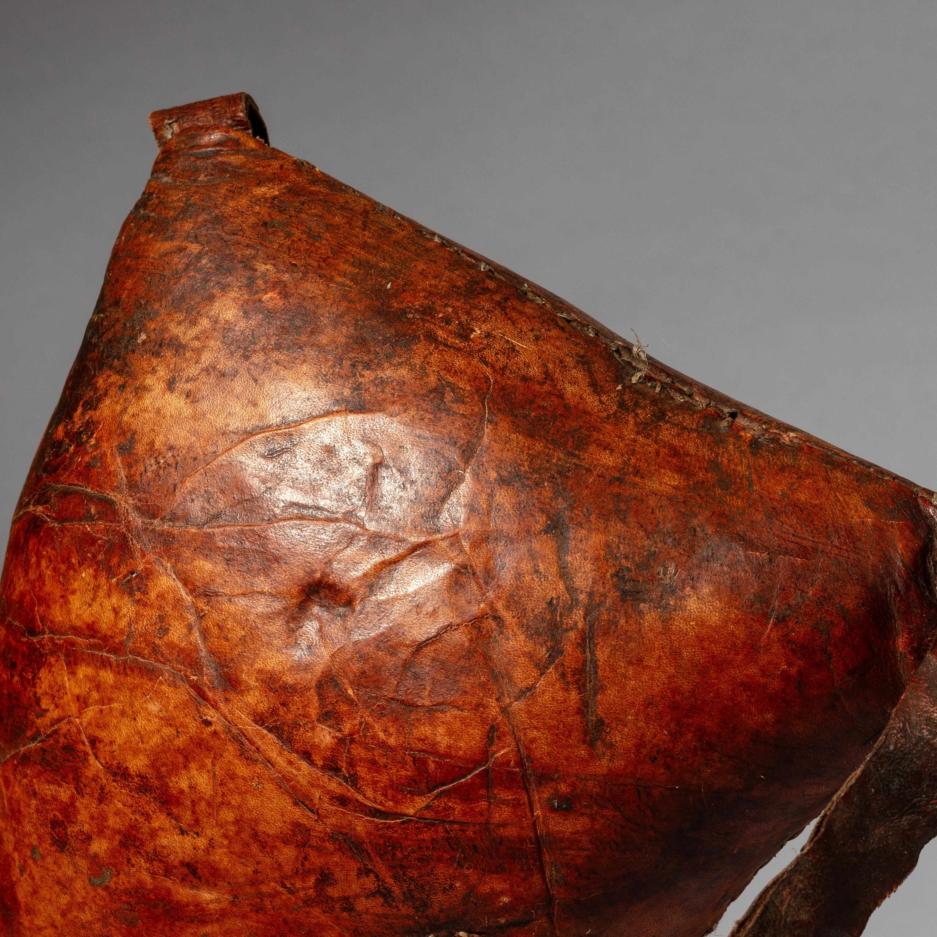 A WARMLY PATINATED ETHIOPIAN LEATHER HEADREST, WELL USED, GURAGE TRIBE, E AFRICA EX UK COLLECTION ( No 4518)