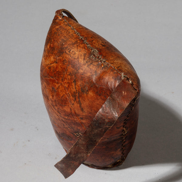 A WARMLY PATINATED ETHIOPIAN LEATHER HEADREST, WELL USED, GURAGE TRIBE, E AFRICA EX UK COLLECTION ( No 4518)