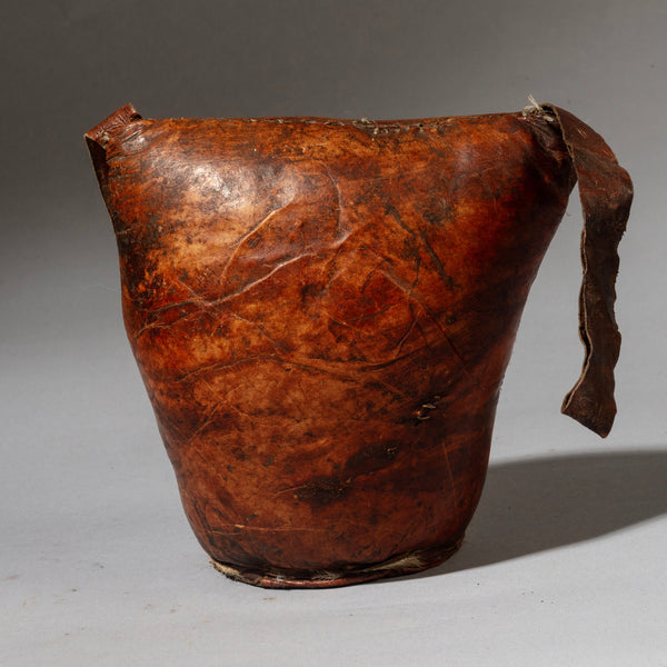 A WARMLY PATINATED ETHIOPIAN LEATHER HEADREST, WELL USED, GURAGE TRIBE, E AFRICA EX UK COLLECTION ( No 4518)