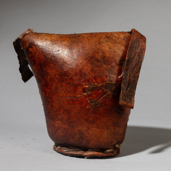 A WARMLY PATINATED ETHIOPIAN LEATHER HEADREST, WELL USED, GURAGE TRIBE, E AFRICA EX UK COLLECTION ( No 4518)