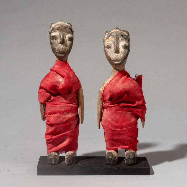A RED FABRIC WRAPPED PAIR OF VENAVI DOLLS FROM EWE TRIBE GHANA WEST AFRICA ( No 4516 )