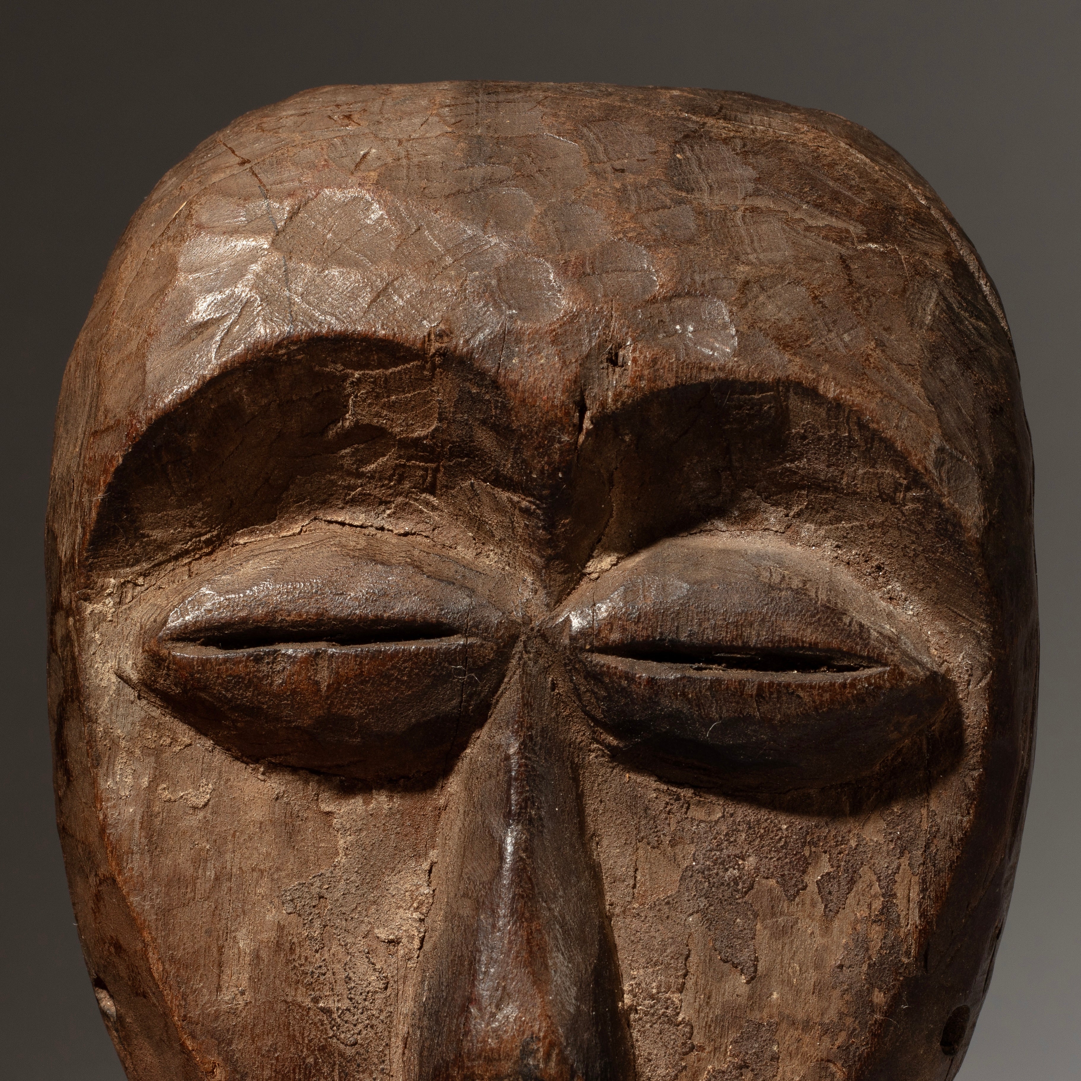 A PRECISE PASSPORT MASK WITH REMNANTS OF PIGMENT , LEGA TRIBE CONGO ( No 4598)