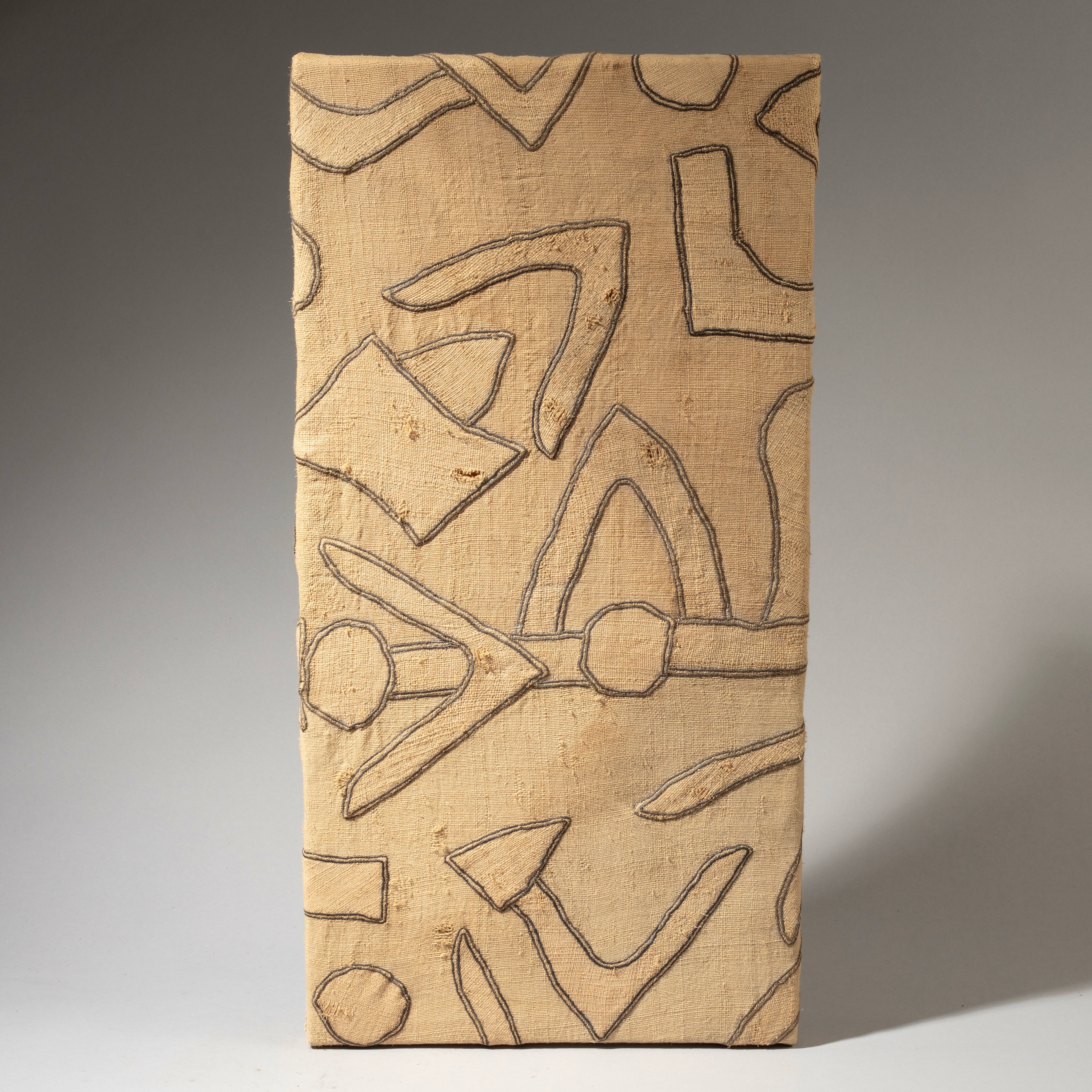 A LIGHT BEIGE PRECISELY APPLIQUÉD MOUNTED OLD RAFFIA SKIRT FROM THE KUBA PEOPLE OF CONGO ( No 4618 )