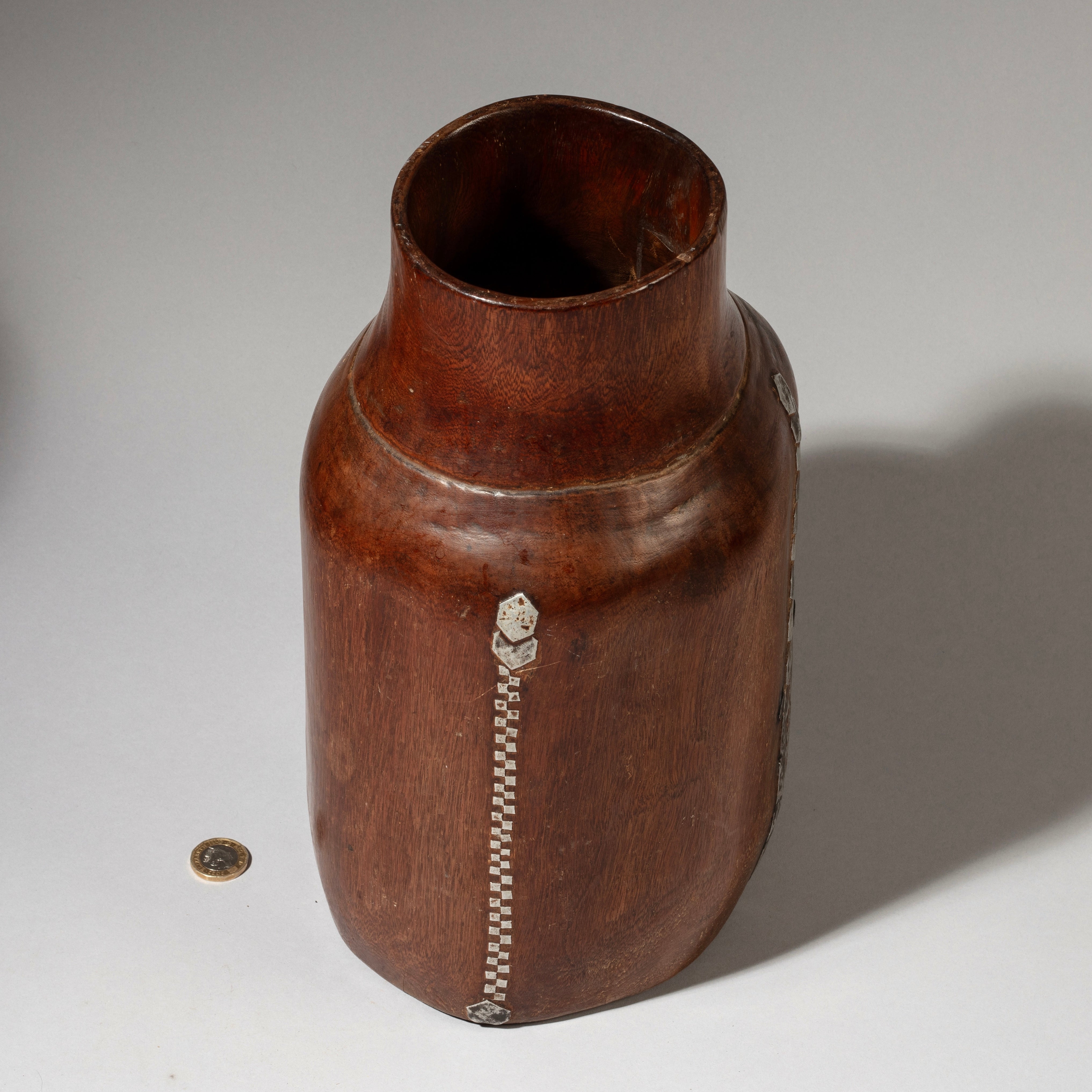 A LARGE  CHUNKY HONEY POT WITH METAL INDIGENOUS REPAIRS FROM THE TUTSI TRIBE OF RWANDA ( No 4608 )
