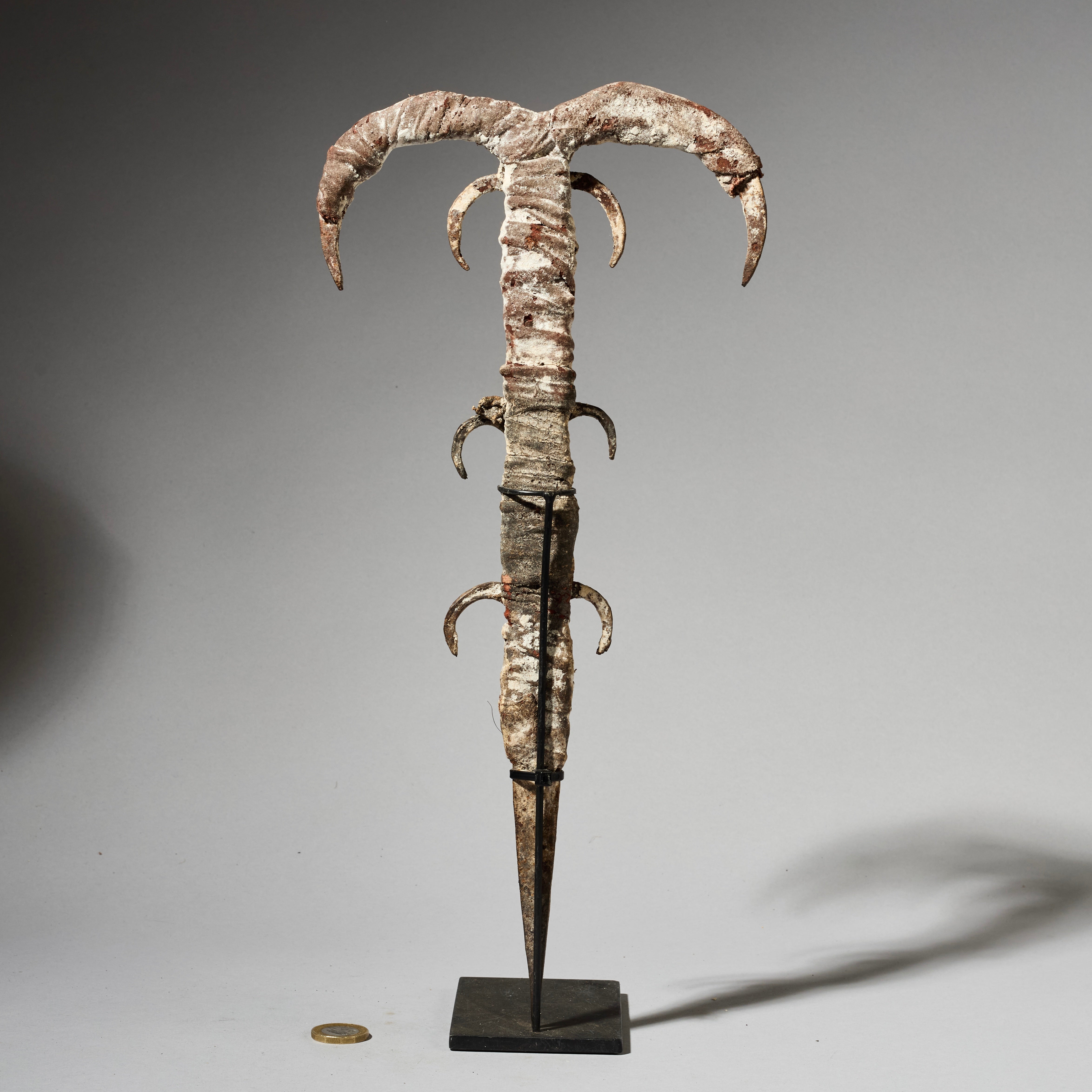 A IRON FIGURE TALISMAN FROM EWE TRIBE OF TOGO , ENCRUSTED WITH COWRIES AND IRON  ( No 4930