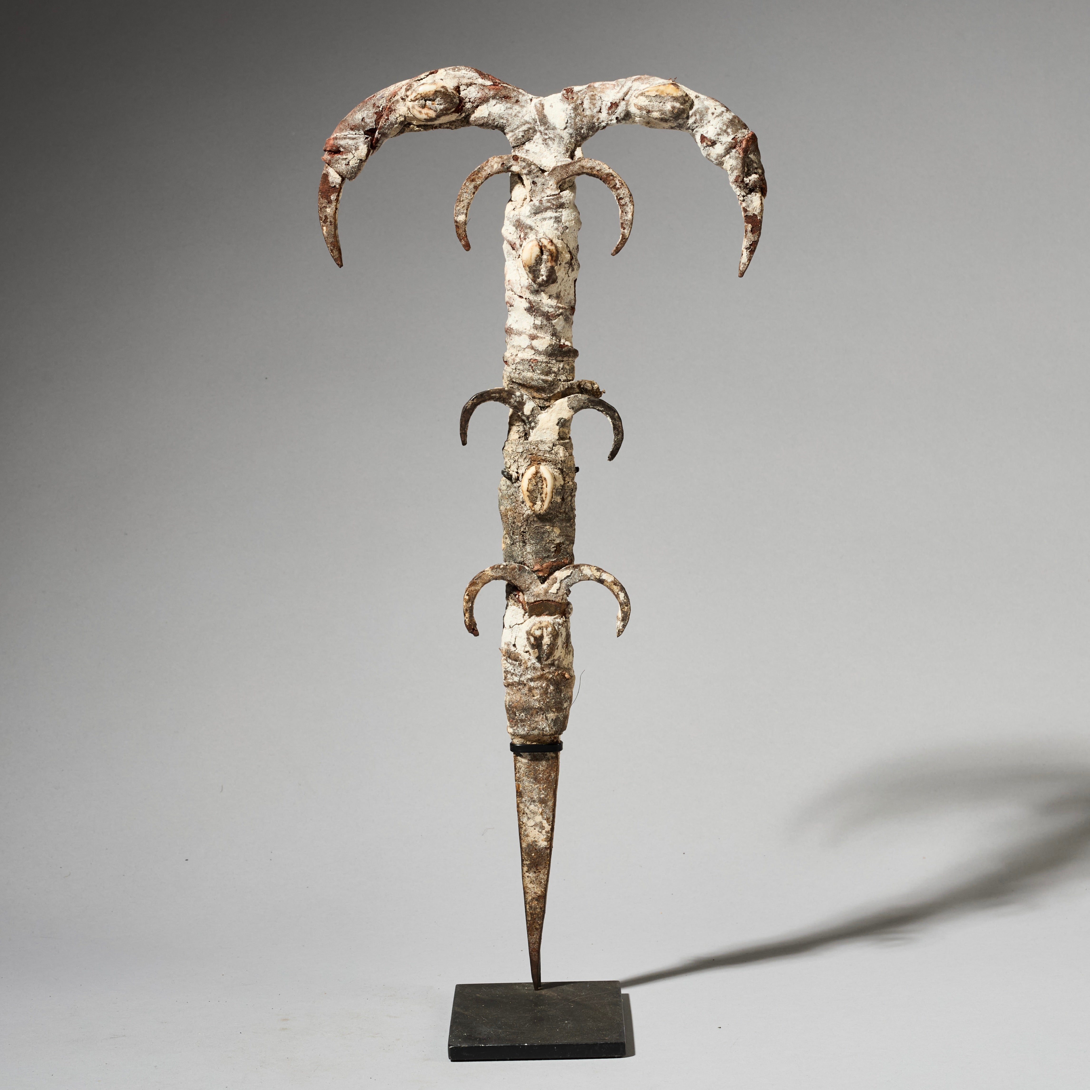 A IRON FIGURE TALISMAN FROM EWE TRIBE OF TOGO , ENCRUSTED WITH COWRIES AND IRON  ( No 4930