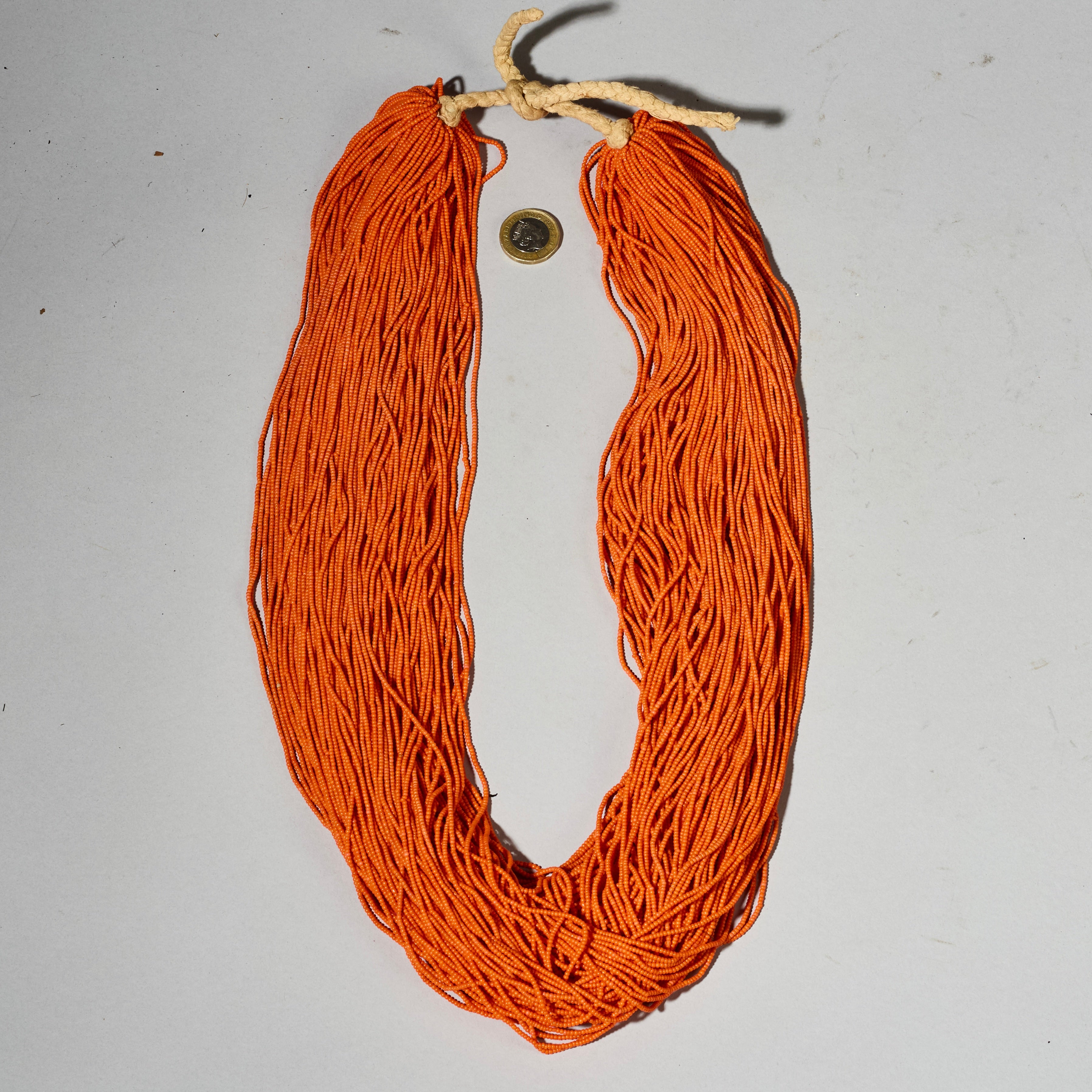 AN ORANGE MULTISTRAND NECKLACE,  BAULE TRIBE IVORY COAST ( No 4926