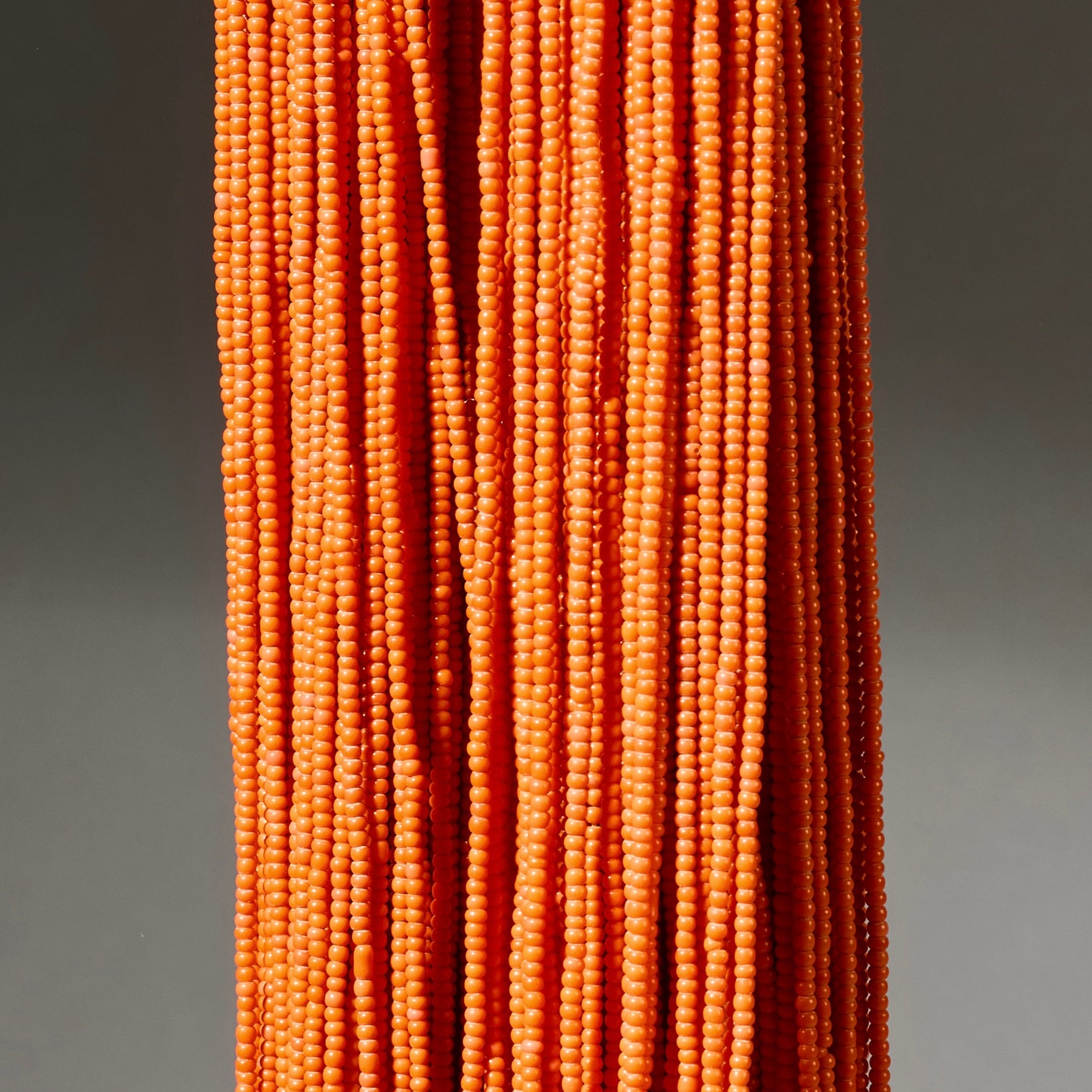AN ORANGE MULTISTRAND NECKLACE,  BAULE TRIBE IVORY COAST ( No 4926