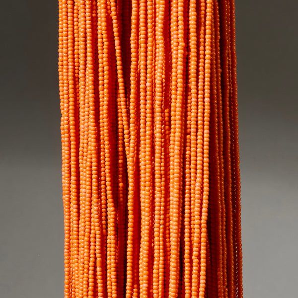 AN ORANGE MULTISTRAND NECKLACE,  BAULE TRIBE IVORY COAST ( No 4926