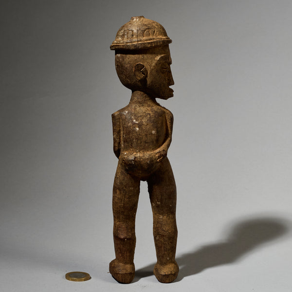 A DYNAMIC LOBI TRIBE THIL STATUE WITH UNUSUAL FEATURES AND SIDEWAYS FORM  ( No 5001)
