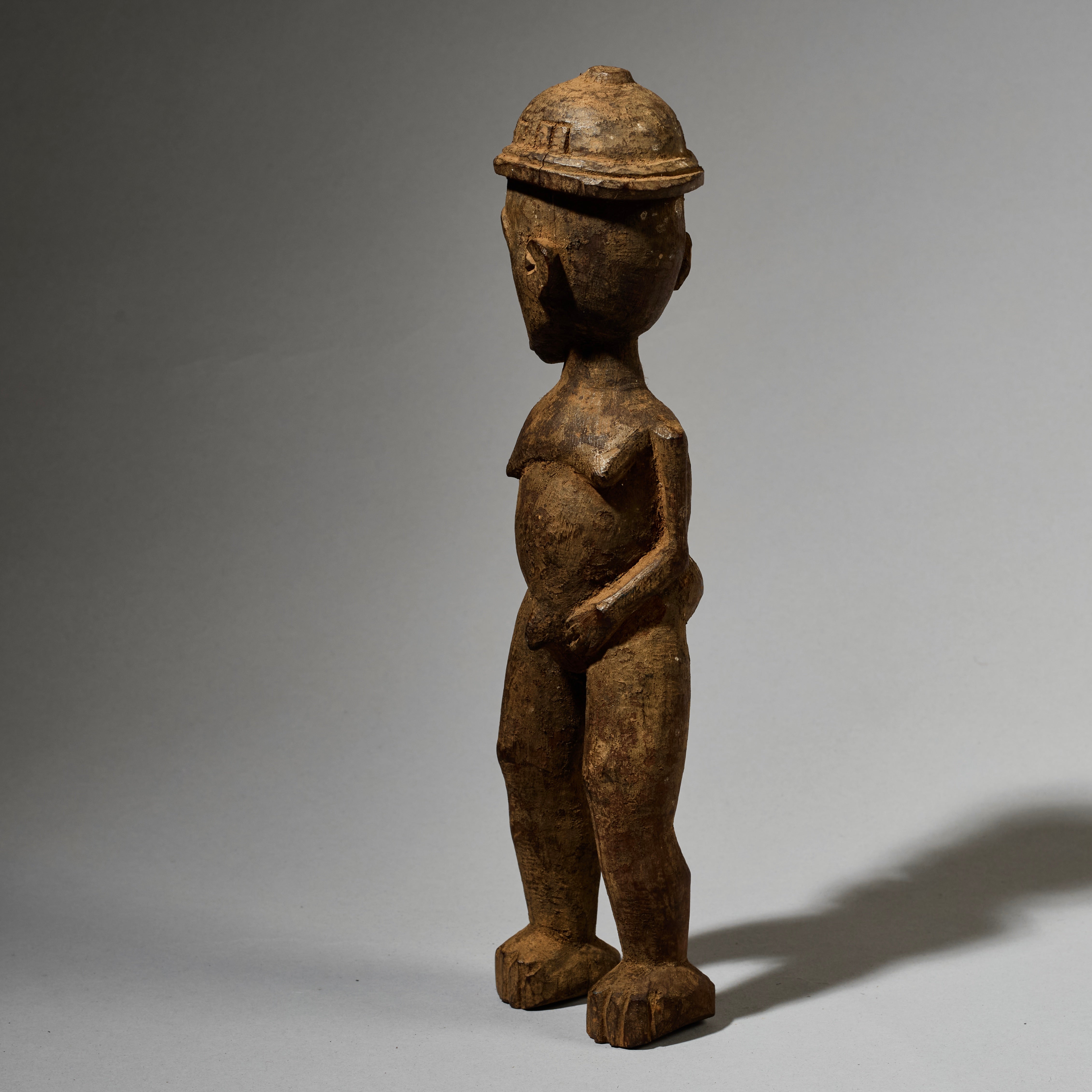 A DYNAMIC LOBI TRIBE THIL STATUE WITH UNUSUAL FEATURES AND SIDEWAYS FORM  ( No 5001)