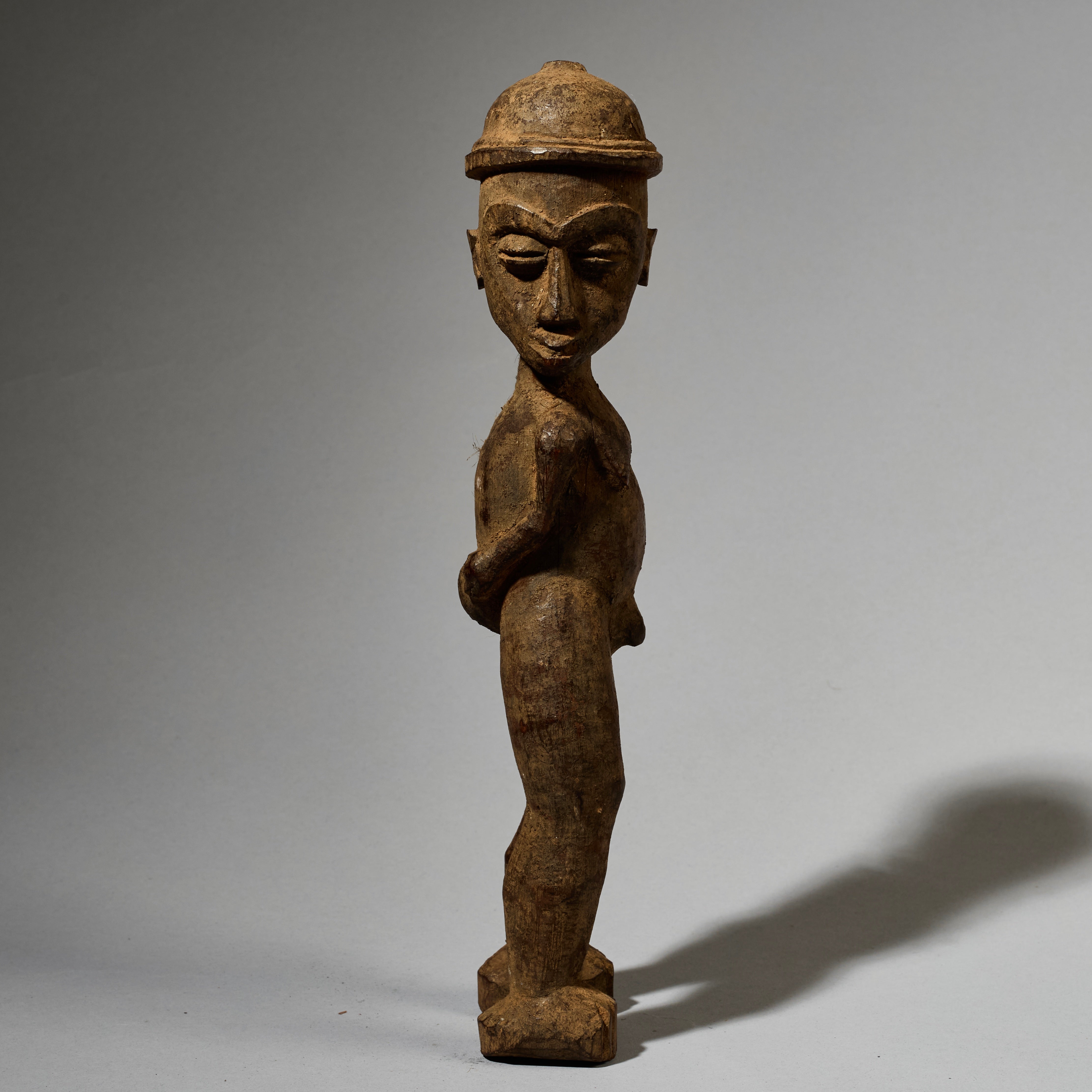 A DYNAMIC LOBI TRIBE THIL STATUE WITH UNUSUAL FEATURES AND SIDEWAYS FORM  ( No 5001)