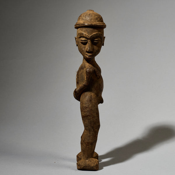 A DYNAMIC LOBI TRIBE THIL STATUE WITH UNUSUAL FEATURES AND SIDEWAYS FORM  ( No 5001)
