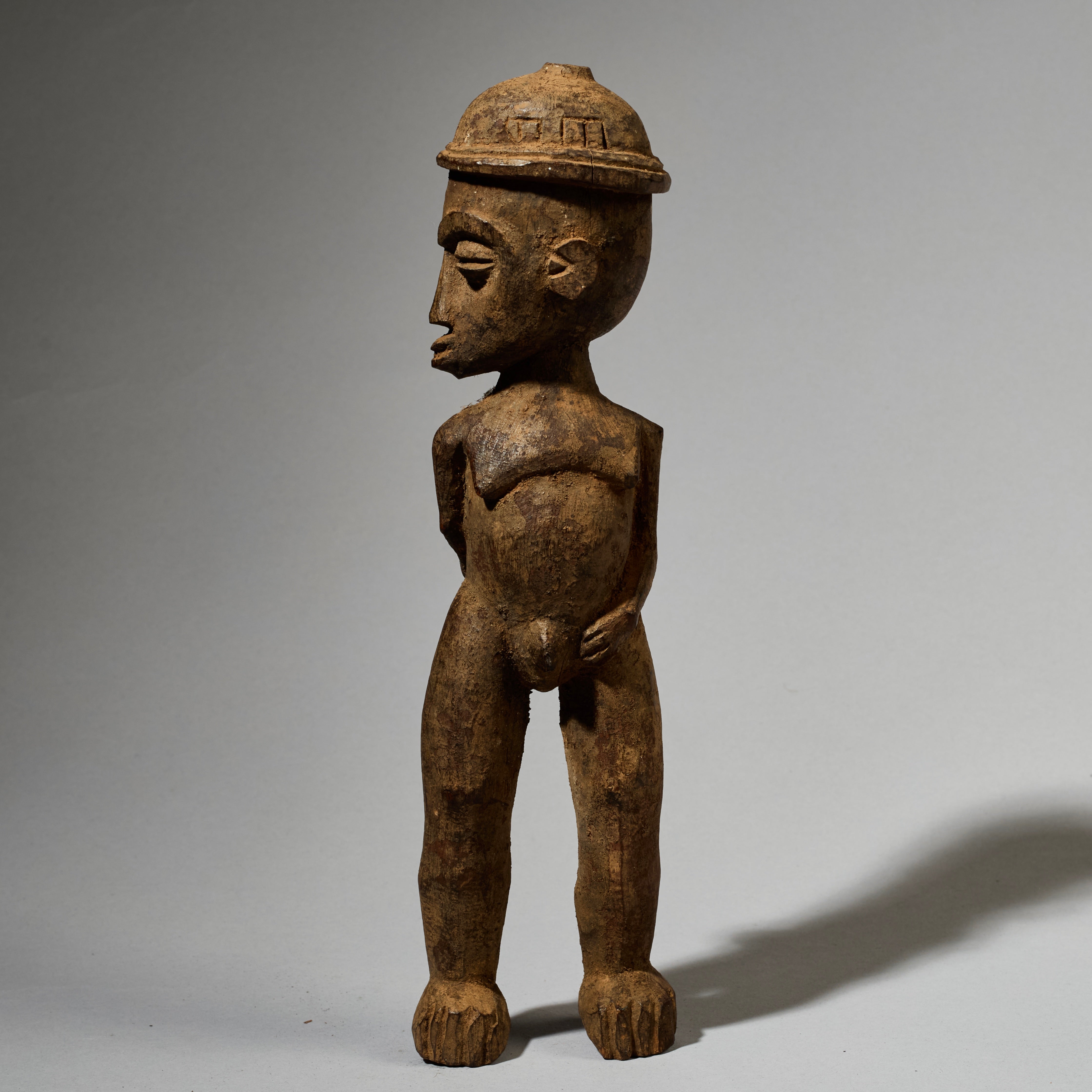 A DYNAMIC LOBI TRIBE THIL STATUE WITH UNUSUAL FEATURES AND SIDEWAYS FORM  ( No 5001)