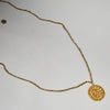 A BOLD  BAULE GILT BRASS NECKLACE WITH GOLD WEIGHT SHAPED DISC PENDANT, IVORY COAST (  No 4980