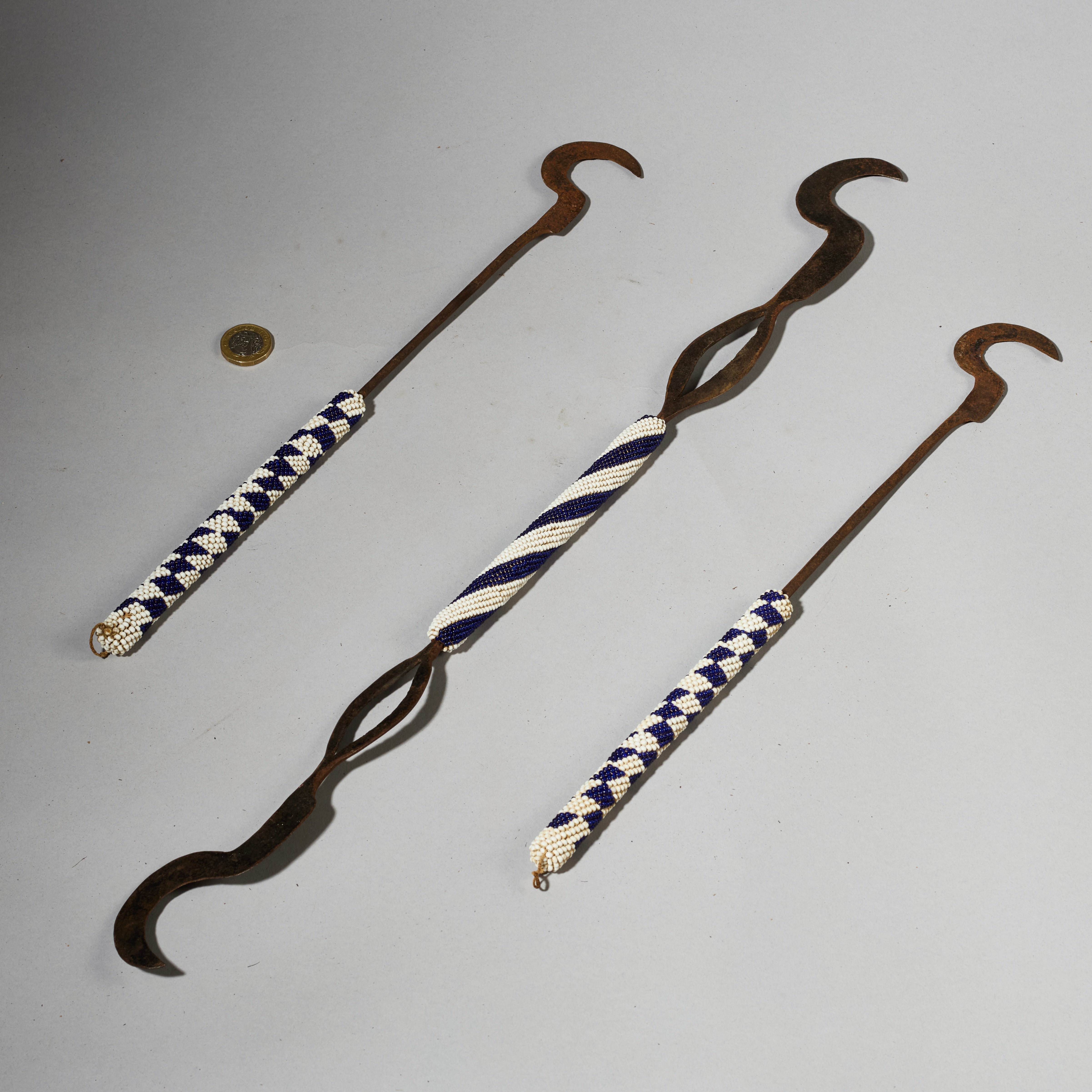 A TRIO OF CEREMONIAL SYTHES FROM THE TUTSI TRIBE OF RWANDA ( No 5026 )