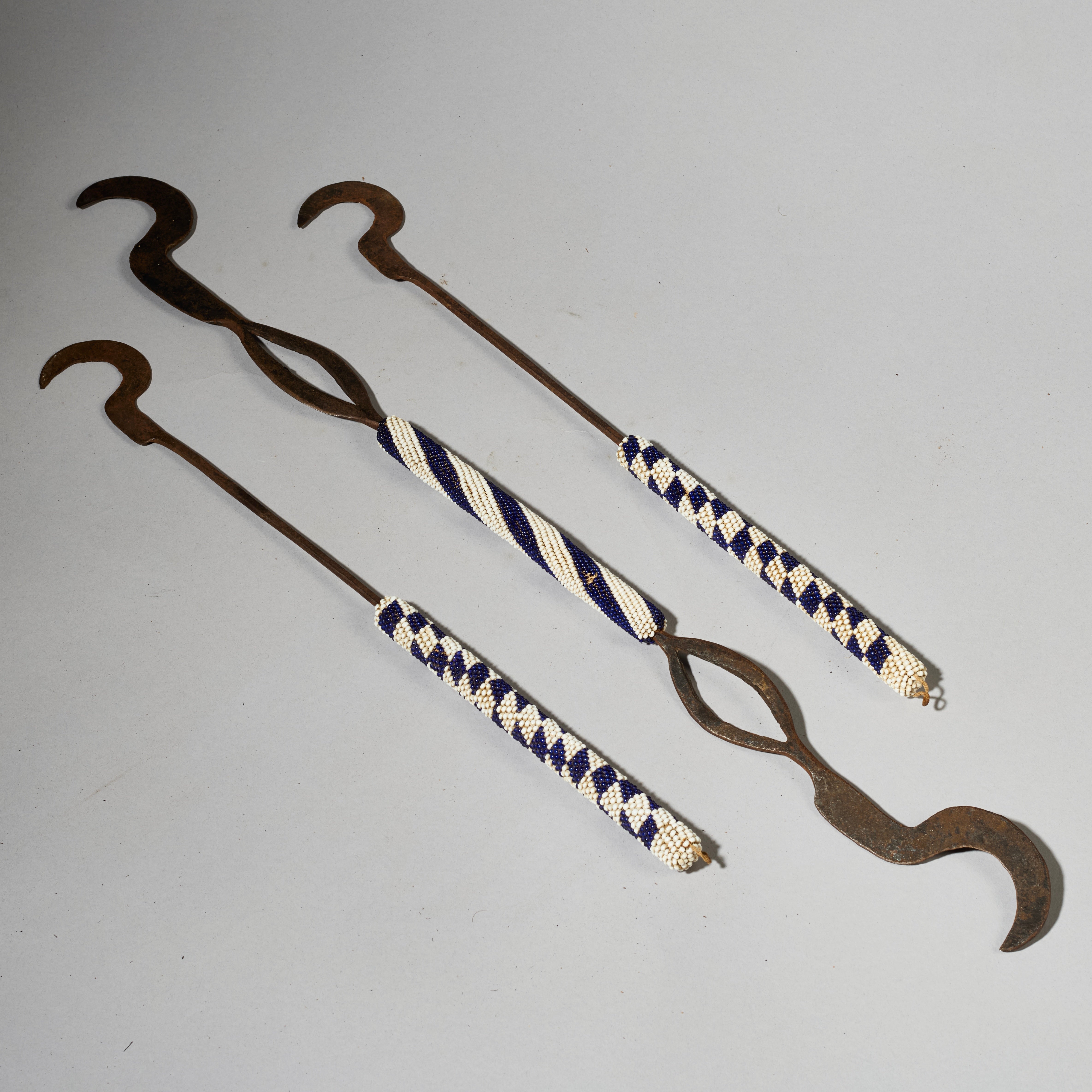 A TRIO OF CEREMONIAL SYTHES FROM THE TUTSI TRIBE OF RWANDA ( No 5026 )