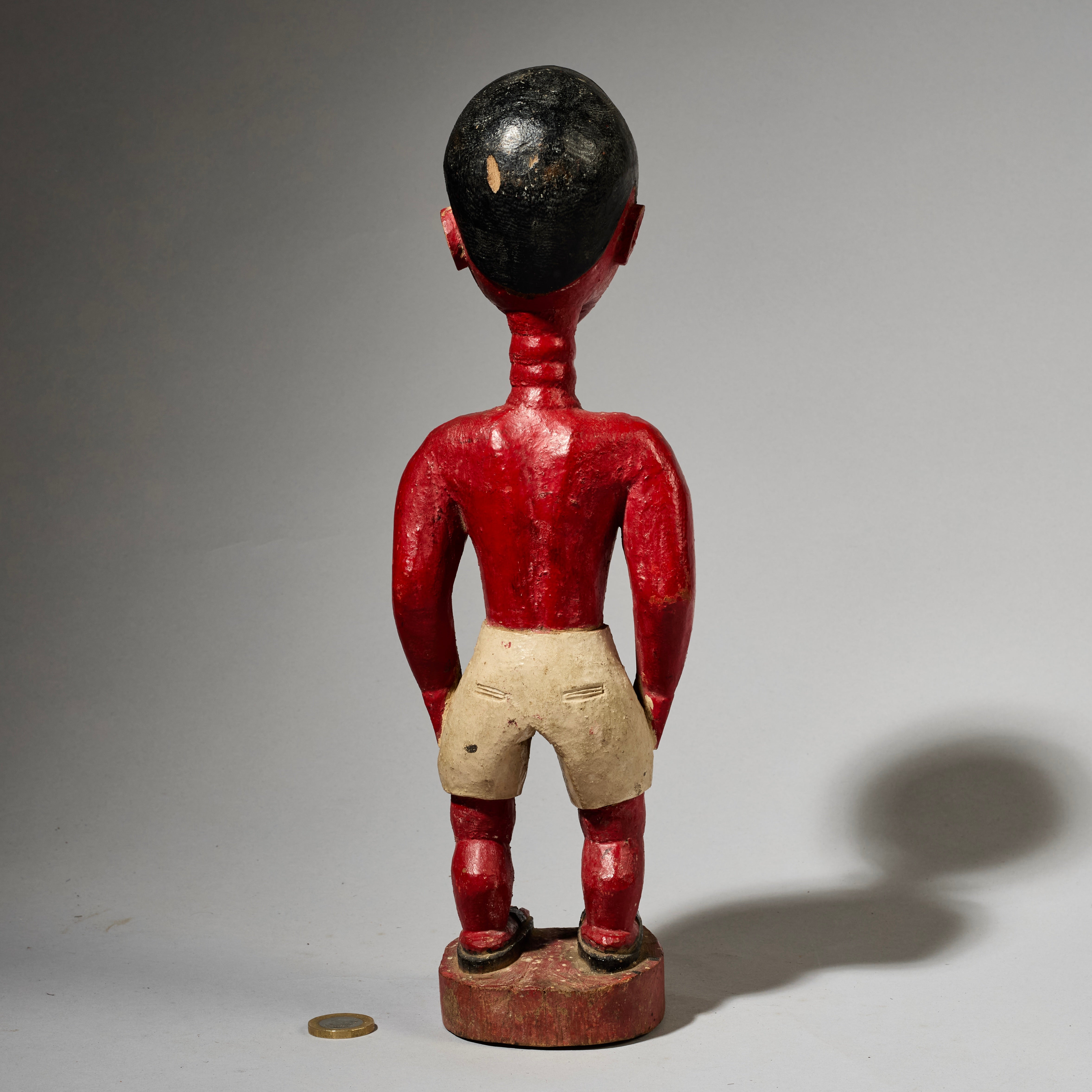 A SCULPTURAL RED COLON FIGURE, BAULE TRIBE IVORY COAST ( No 5000