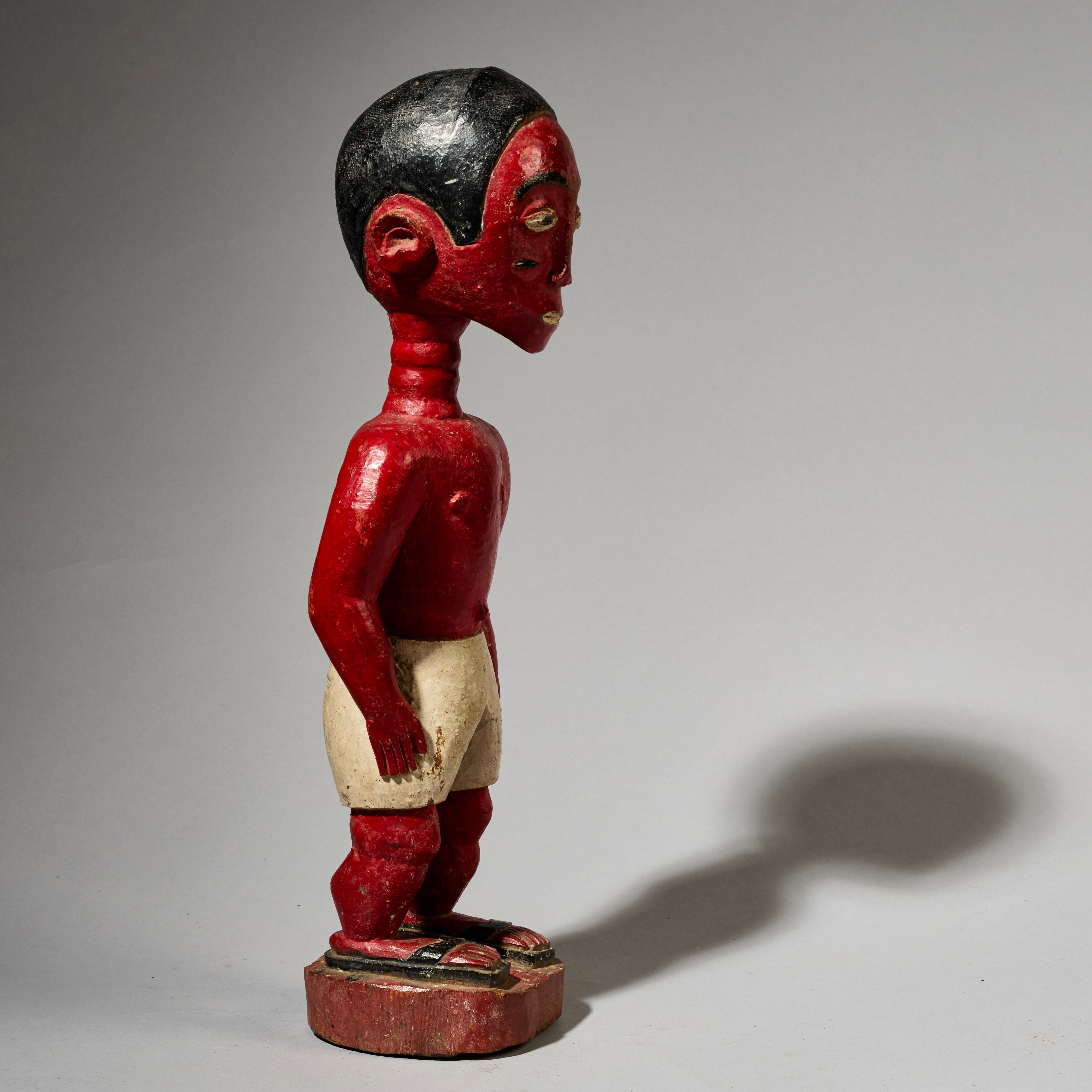 A SCULPTURAL RED COLON FIGURE, BAULE TRIBE IVORY COAST ( No 5000
