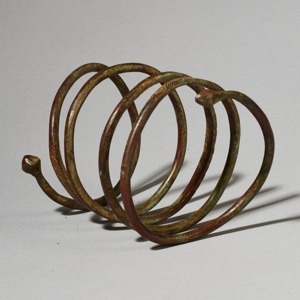 AN ELEMENTAL BRASS COIL BANGLE FROM KIRDI TRIBE CAMEROON, W.AFRICA( No 2202) (Copy)