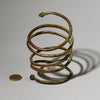AN ELEMENTAL BRASS COIL BANGLE FROM KIRDI TRIBE CAMEROON, W.AFRICA( No 2202) (Copy)