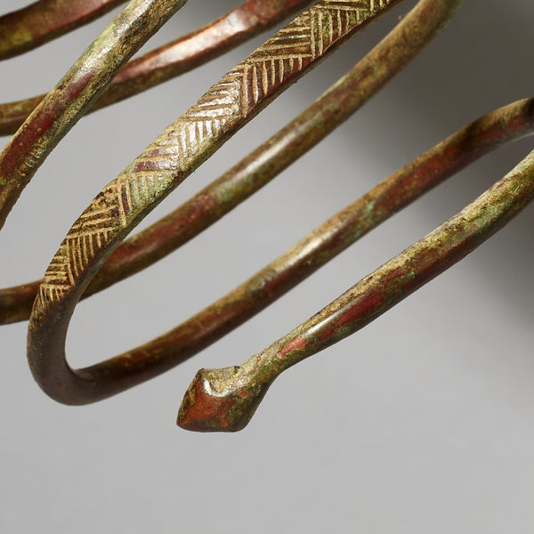 AN ELEMENTAL BRASS COIL BANGLE FROM KIRDI TRIBE CAMEROON, W.AFRICA( No 2202) (Copy)