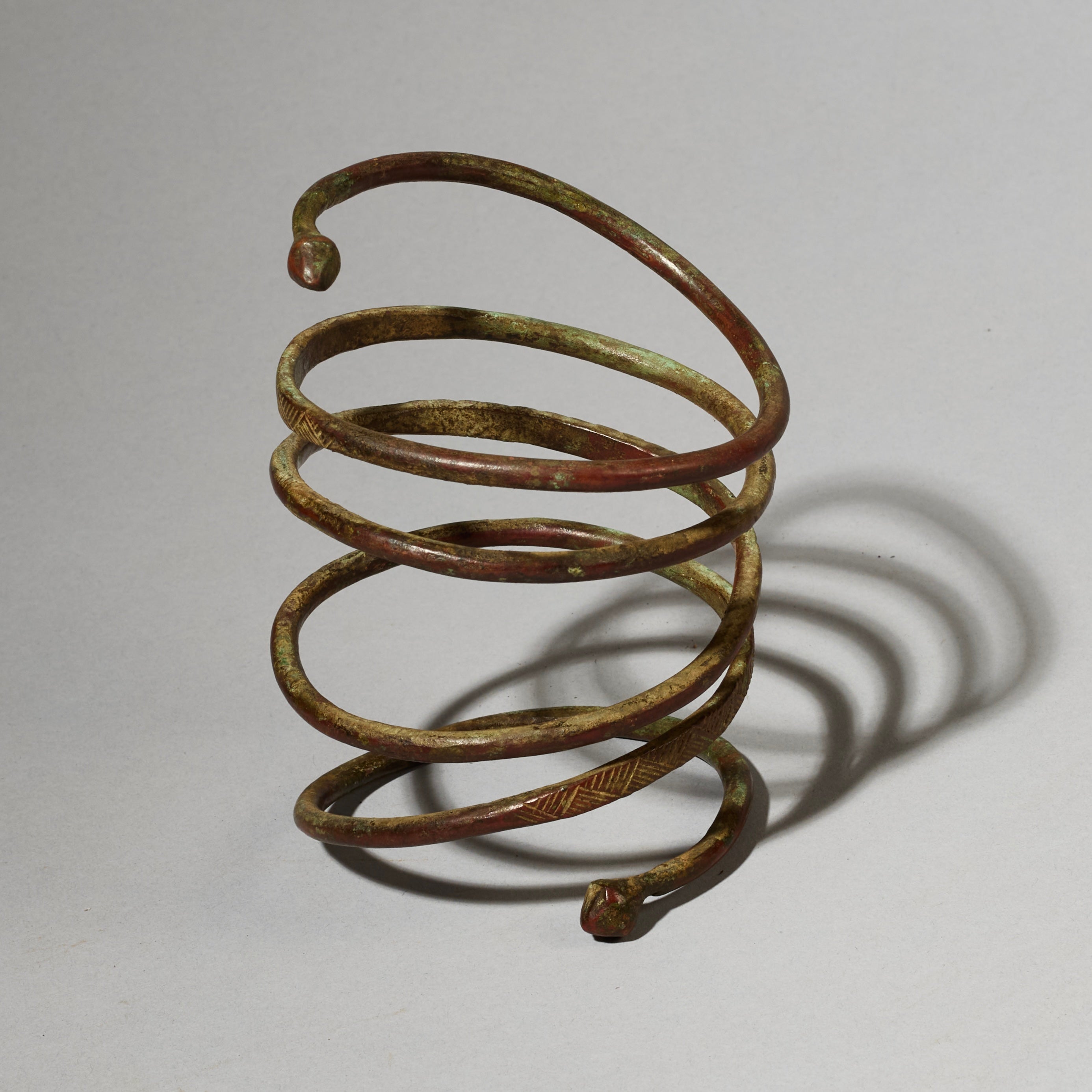 AN ELEMENTAL BRASS COIL BANGLE FROM KIRDI TRIBE CAMEROON, W.AFRICA( No 2202) (Copy)