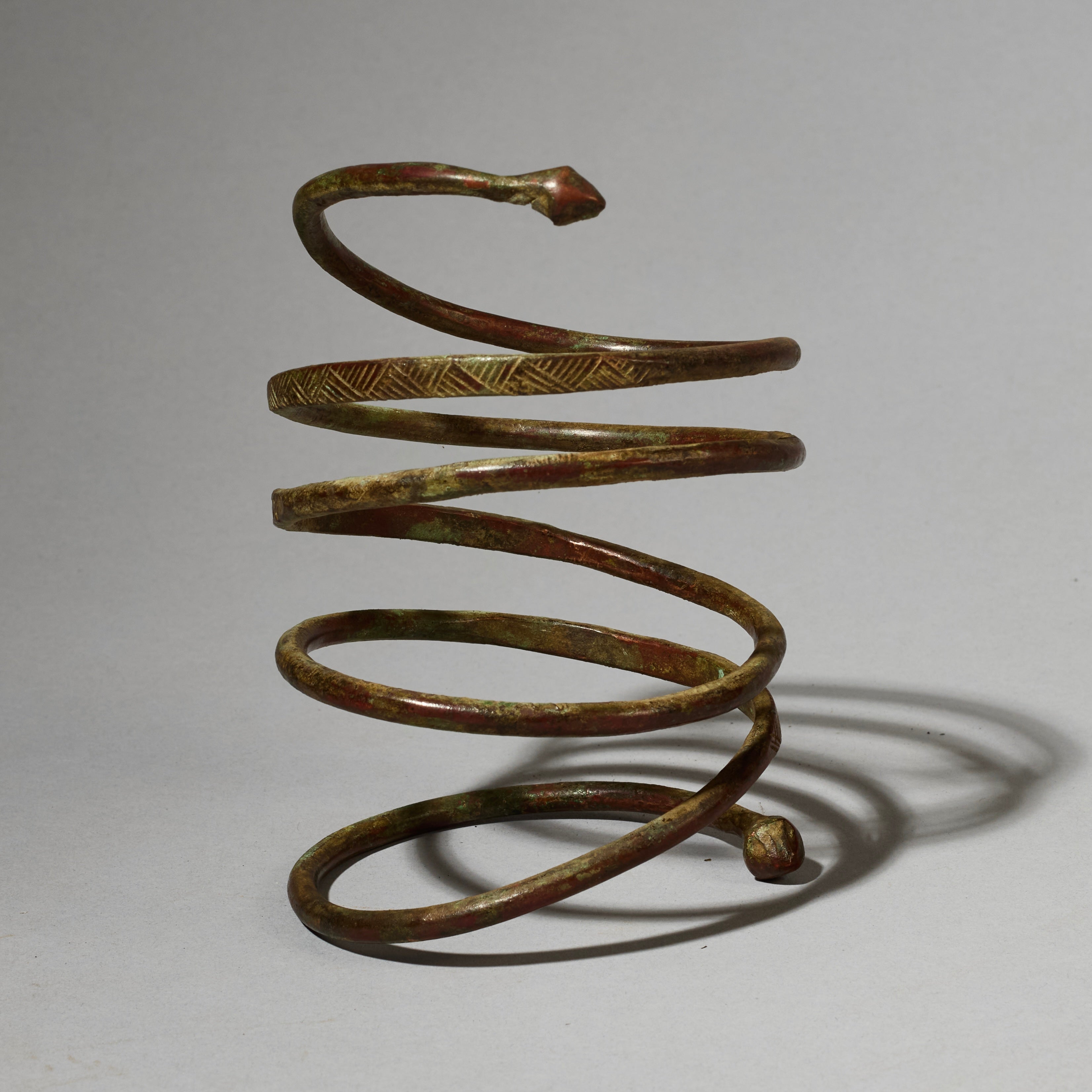 AN ELEMENTAL BRASS COIL BANGLE FROM KIRDI TRIBE CAMEROON, W.AFRICA( No 2202) (Copy)