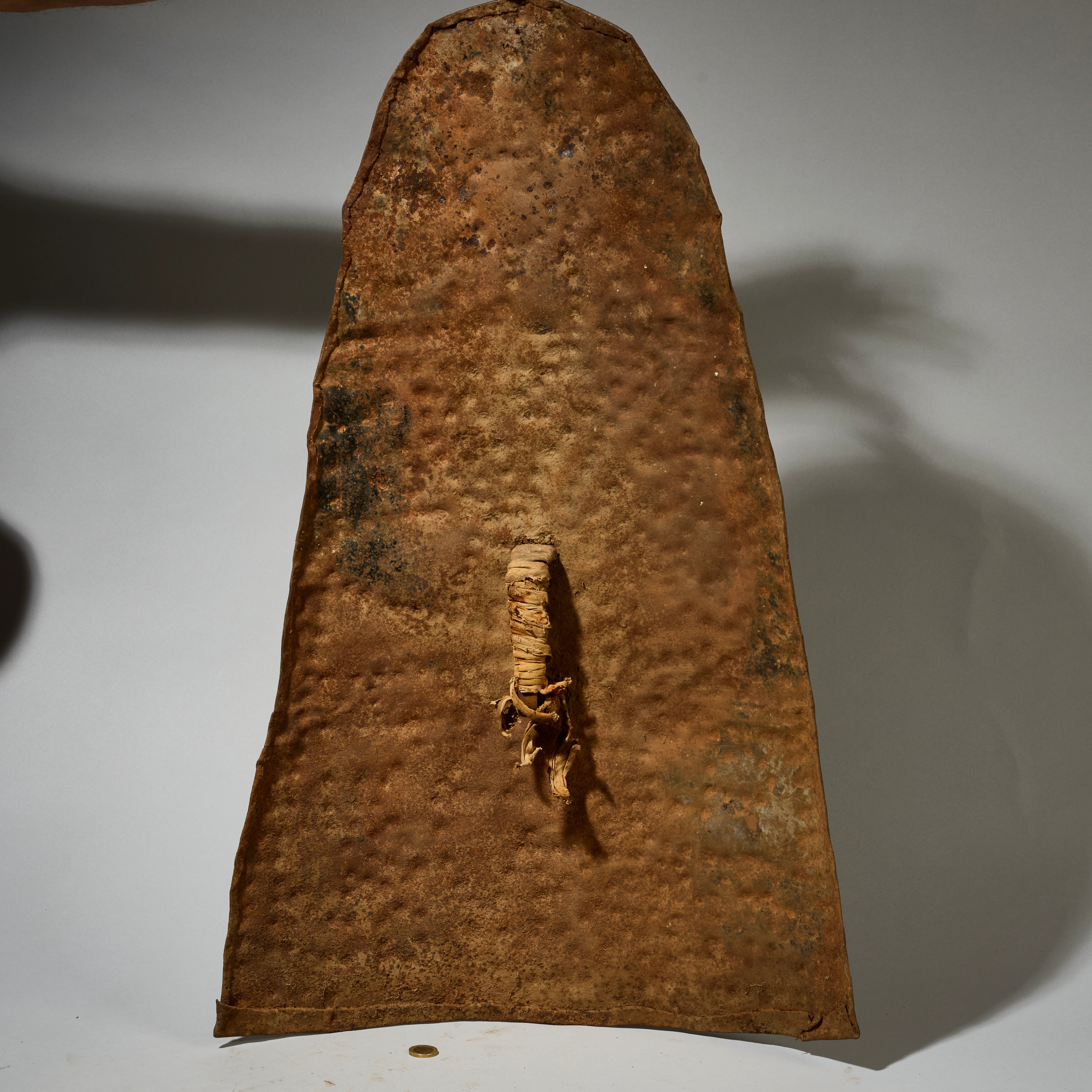 AN EMBOSSED, BELL SHAPED SHIELD, KIRDI TRIBE N CAMEROON, W.AFRICA WITH GOOD AGE AND PATINA  ( No 5074)