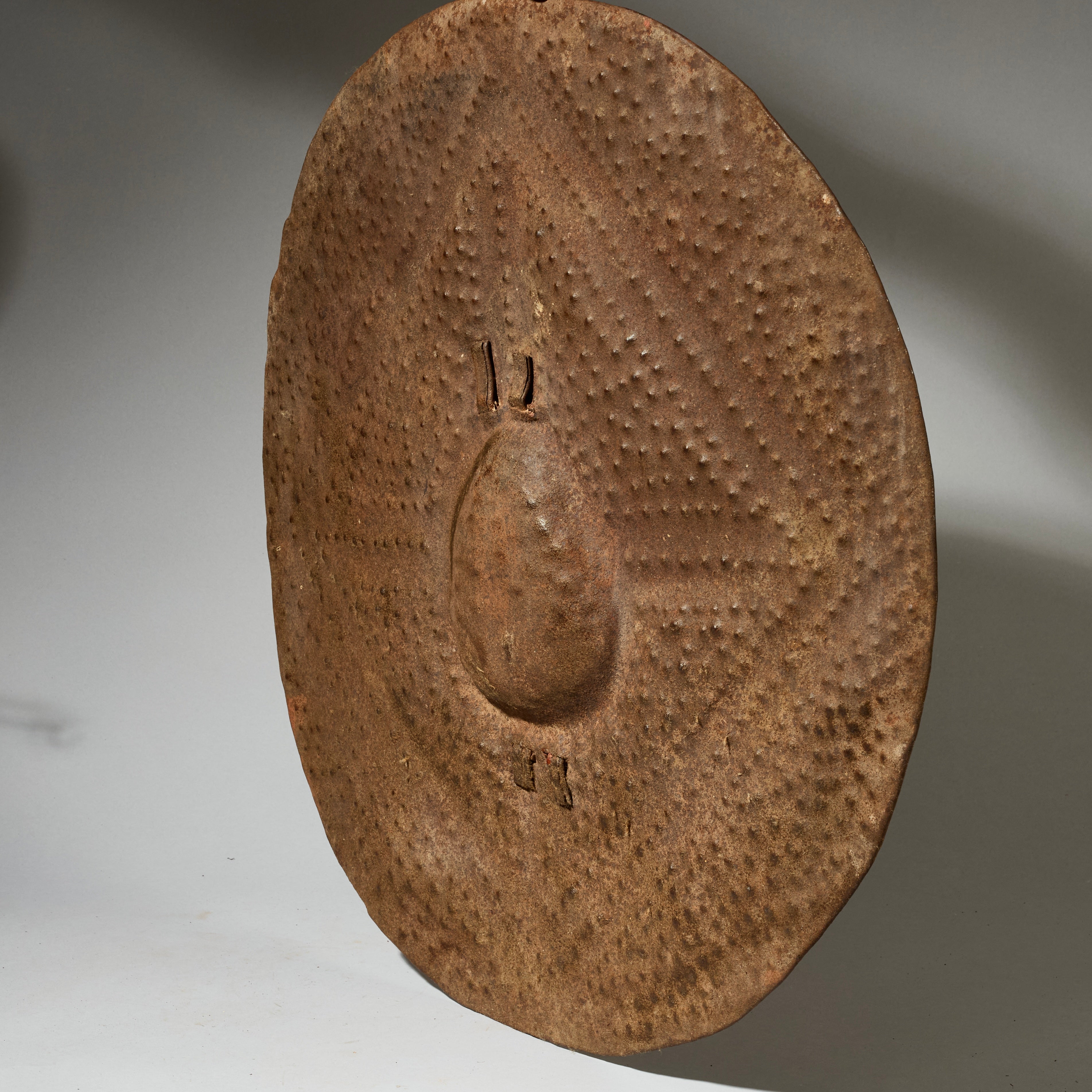 A BUMPY ROUND SHIELD, KIRDI TRIBE N CAMEROON, W.AFRICA WITH GOOD AGE AND PATINA  ( No 5075 )