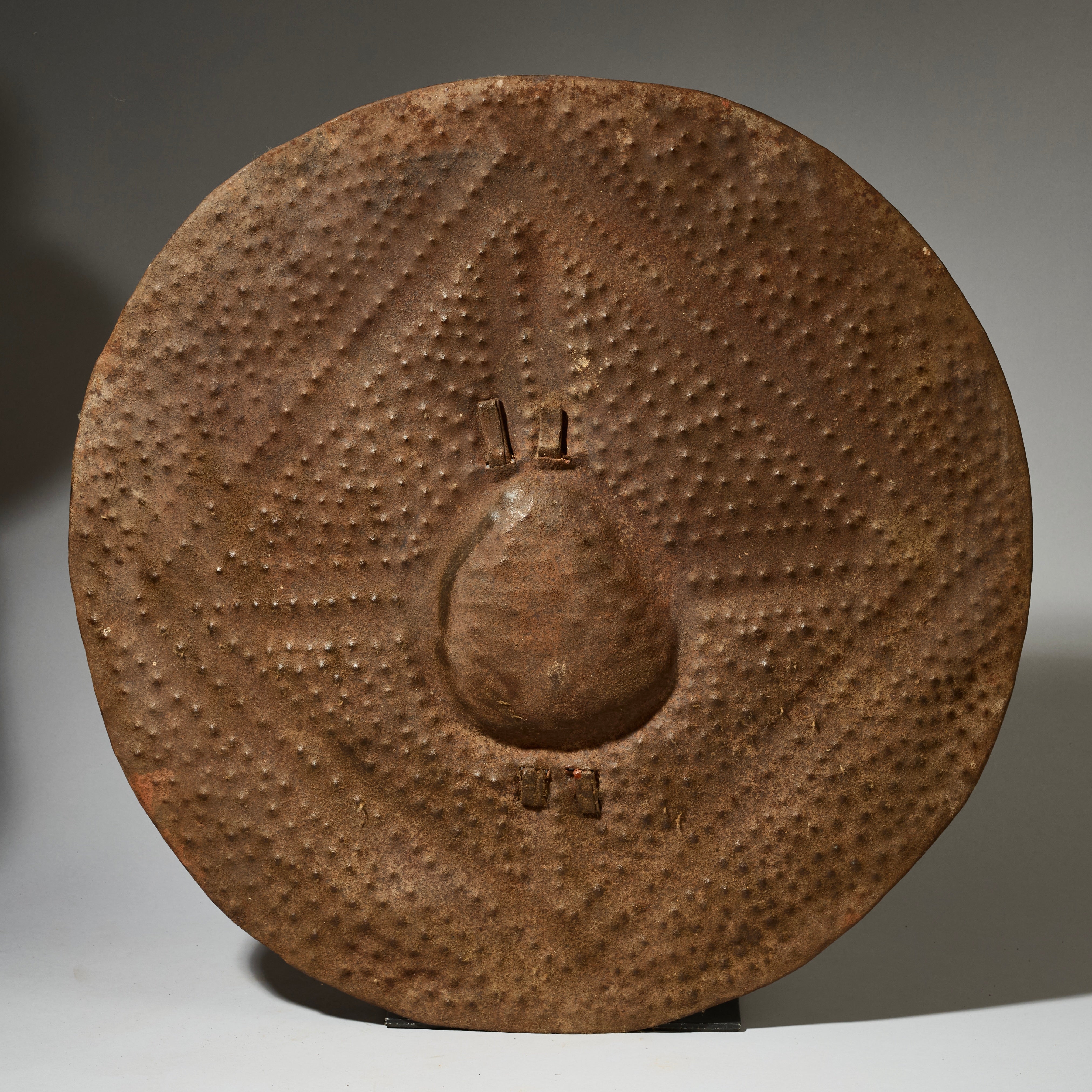 A BUMPY ROUND SHIELD, KIRDI TRIBE N CAMEROON, W.AFRICA WITH GOOD AGE AND PATINA  ( No 5075 )