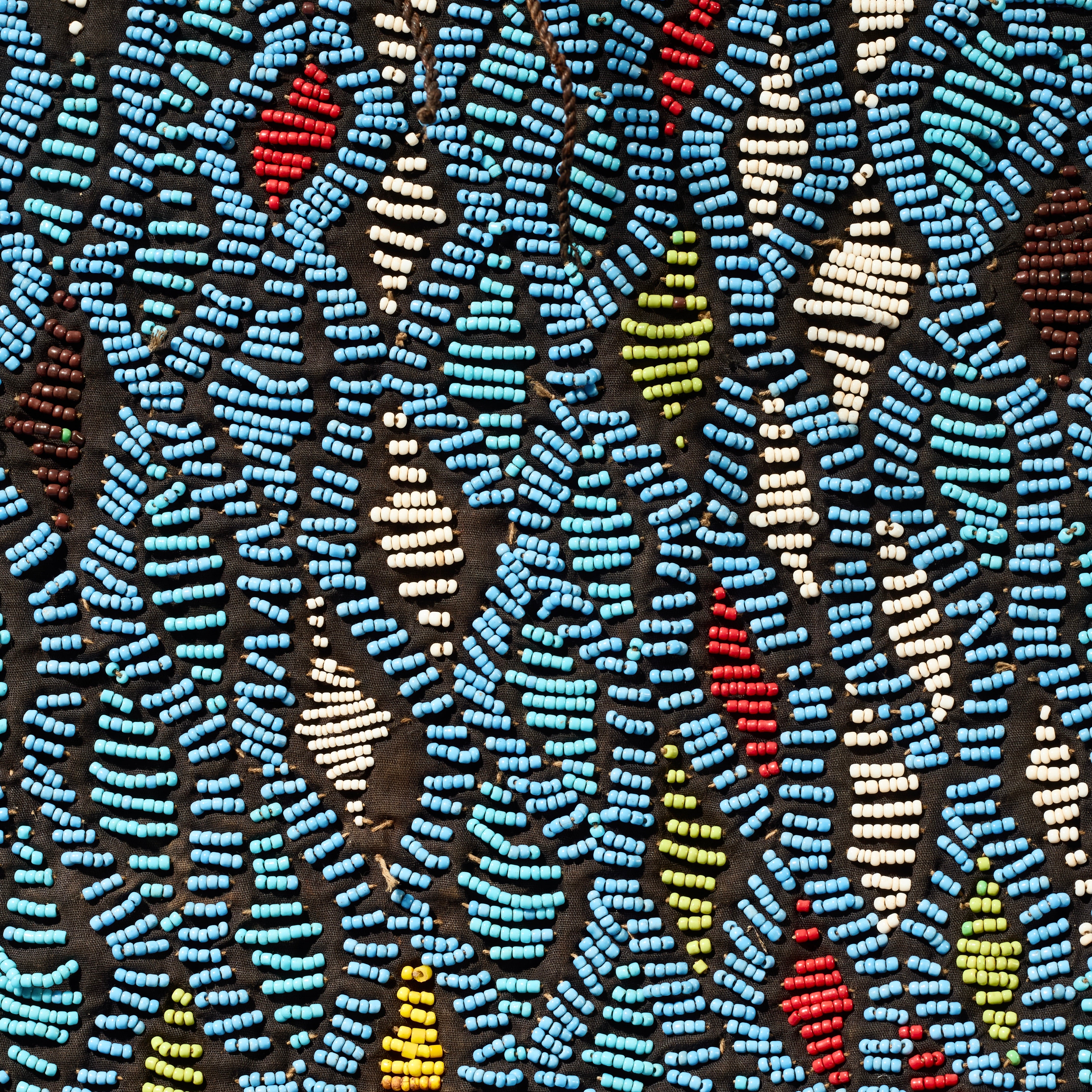 AN ARTISTIC BEADED SHIRT WITH NDOP TRIM, BAMILEKE TRIBE OF CAMEROON ( No 5113 )
