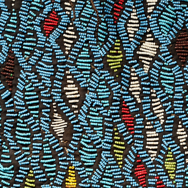 AN ARTISTIC BEADED SHIRT WITH NDOP TRIM, BAMILEKE TRIBE OF CAMEROON ( No 5113 )