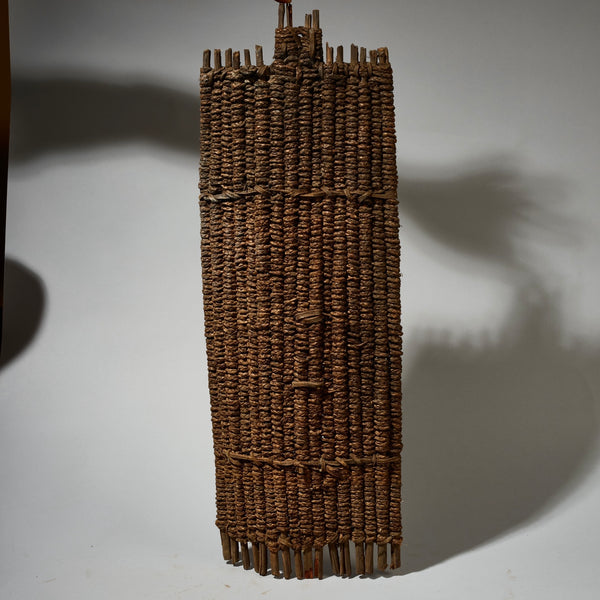 AN EARTHY NATURAL FIBRE SHIELD FROM THE NGOMBE TRIBE OF THE CONGO, EX UK COLLECTION  [ No 5076 )