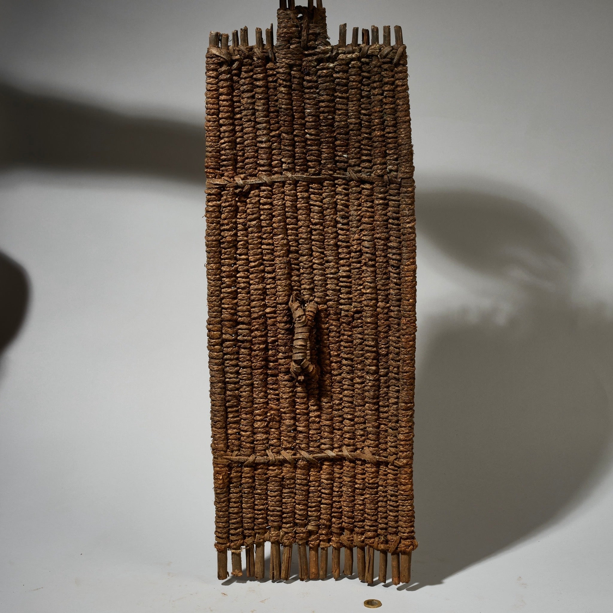 AN EARTHY NATURAL FIBRE SHIELD FROM THE NGOMBE TRIBE OF THE CONGO, EX UK COLLECTION  [ No 5076 )