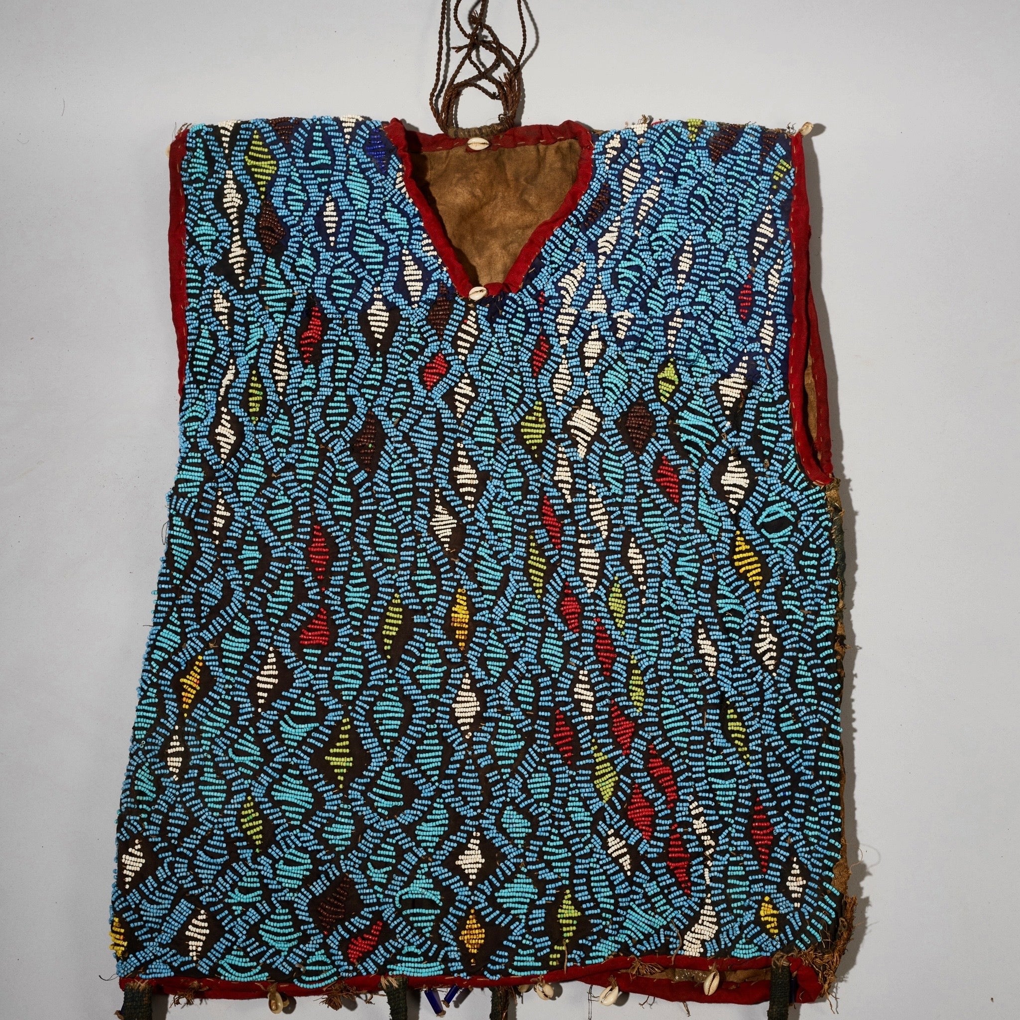 AN ARTISTIC BEADED SHIRT WITH NDOP TRIM, BAMILEKE TRIBE OF CAMEROON ( No 5113 )