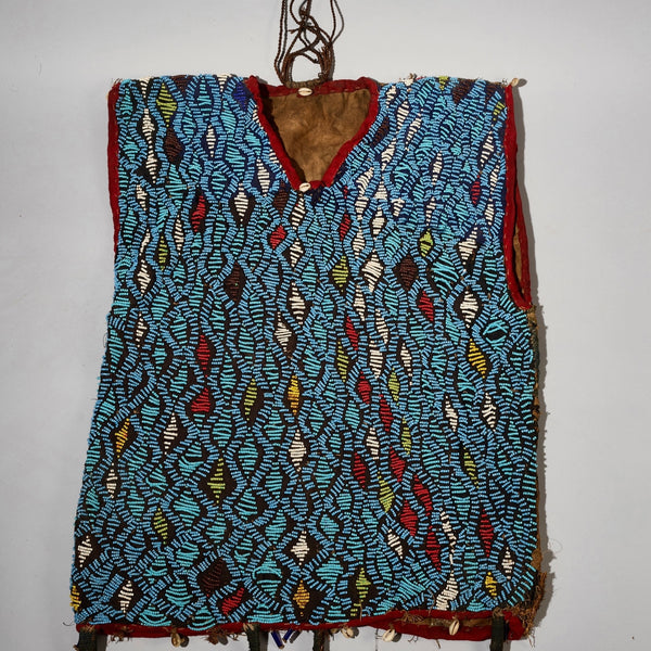 AN ARTISTIC BEADED SHIRT WITH NDOP TRIM, BAMILEKE TRIBE OF CAMEROON ( No 5113 )