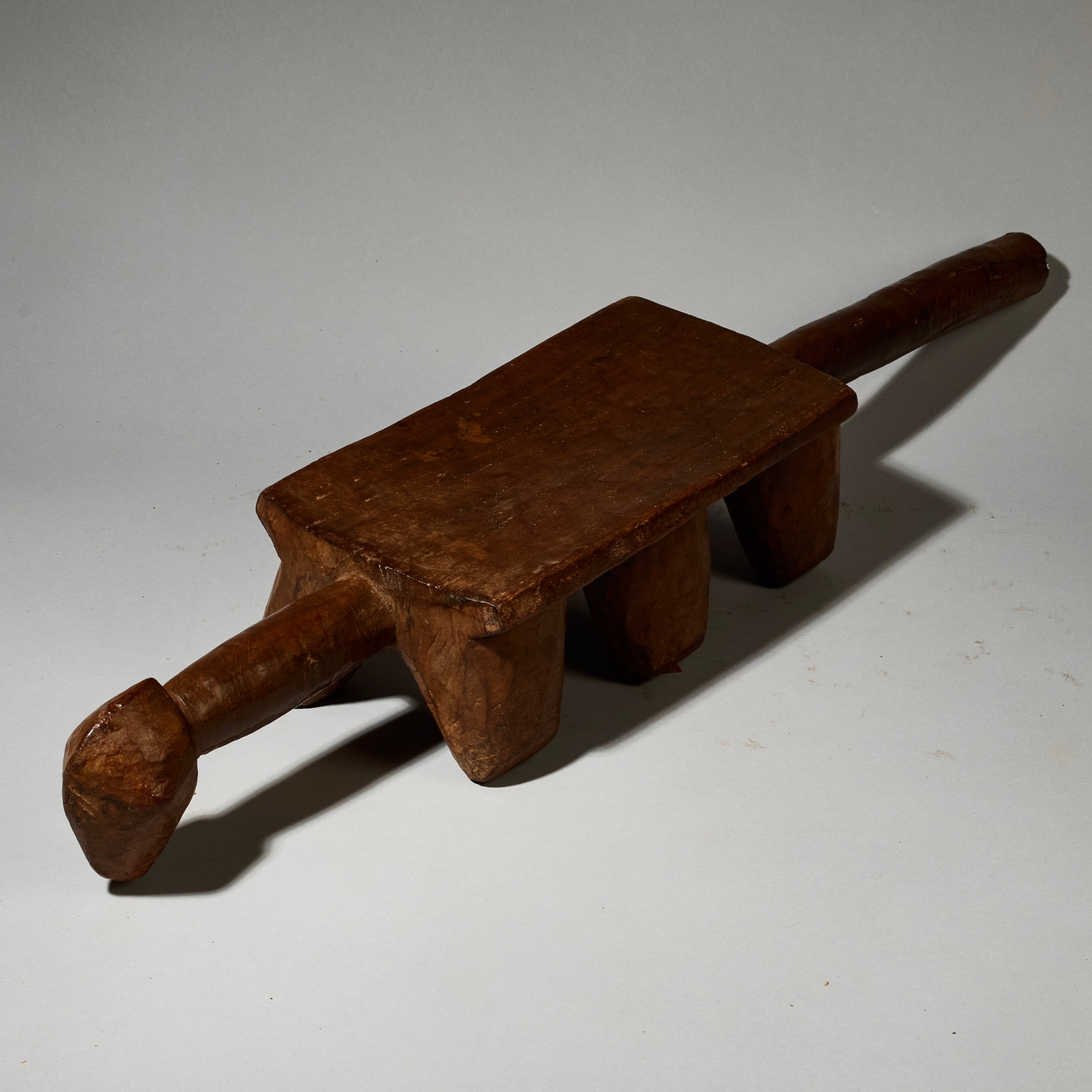 AN ABSTRACTED LONG ANIMAL STOOL FROM BURKINA FASO ( No 5162 )