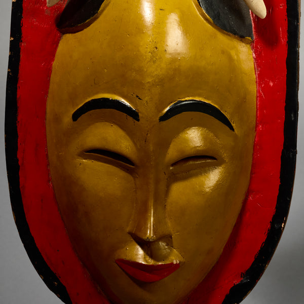 A RADIANT YELLOW GURO MASK WITH BIRDS,  FROM THE IVORY COAST W AFRICA ( No 5154 )