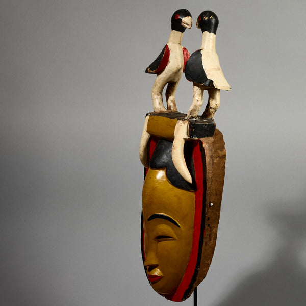 A RADIANT YELLOW GURO MASK WITH BIRDS,  FROM THE IVORY COAST W AFRICA ( No 5154 )
