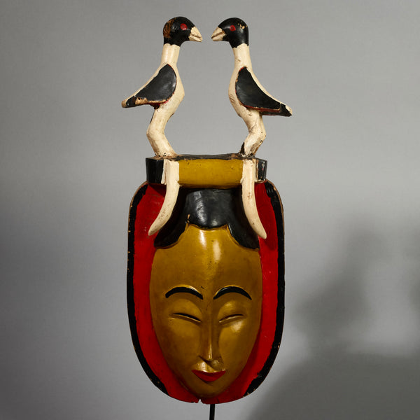 A RADIANT YELLOW GURO MASK WITH BIRDS,  FROM THE IVORY COAST W AFRICA ( No 5154 )