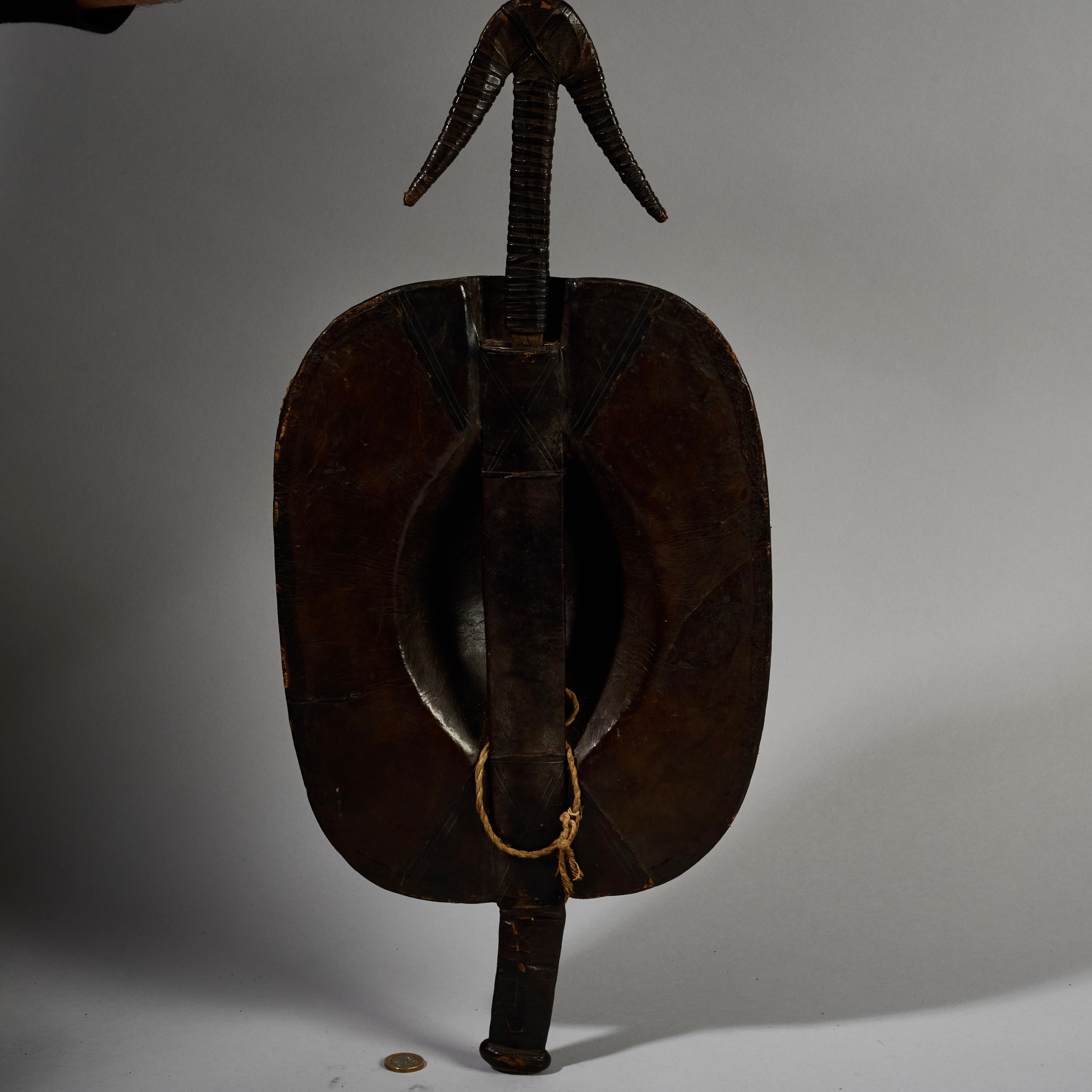 A RARE SHAPED LEATHER SHIELD, WITH INBUILT SWORD, FROM SHILUK PEOPLE  E.AFRICA ( No 6295