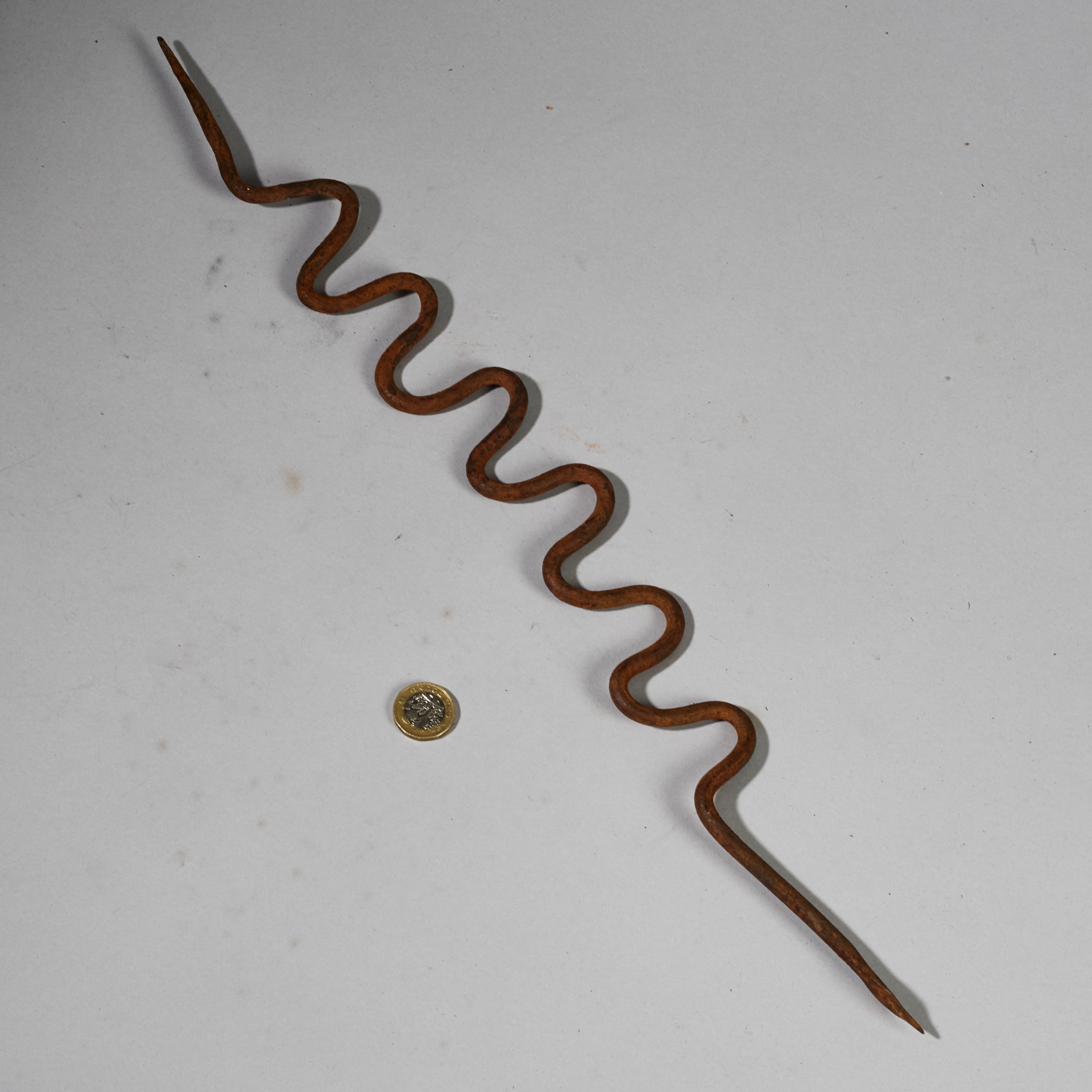 AN OXIDISED IRON SNAKE TALISMAN FROM THE LOBI TRIBE OF BURKINA FASO ( No 6229)