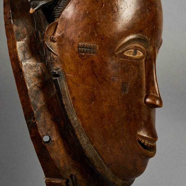 A PRETTY FEMININE MASK, BAULE TRIBE IVORY COAST EX UK COLLECTION ( No 6298)