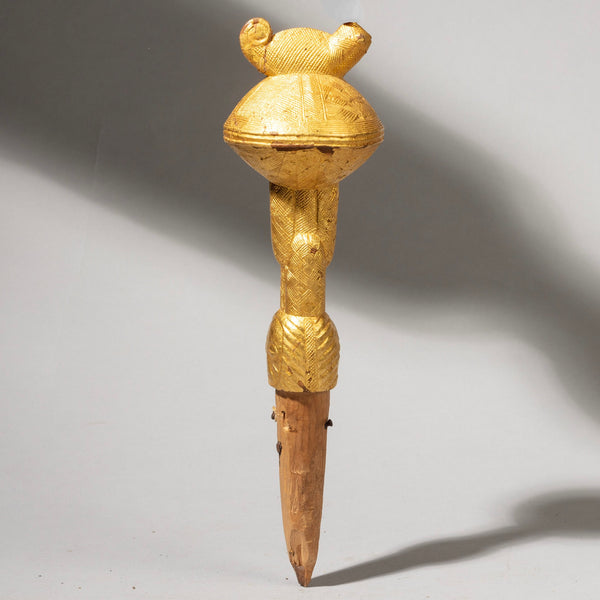 A GOLD LEAF COVERED FLY WHISK HANDLE, BAULE TRIBE IVORY COAST( No 1165 )