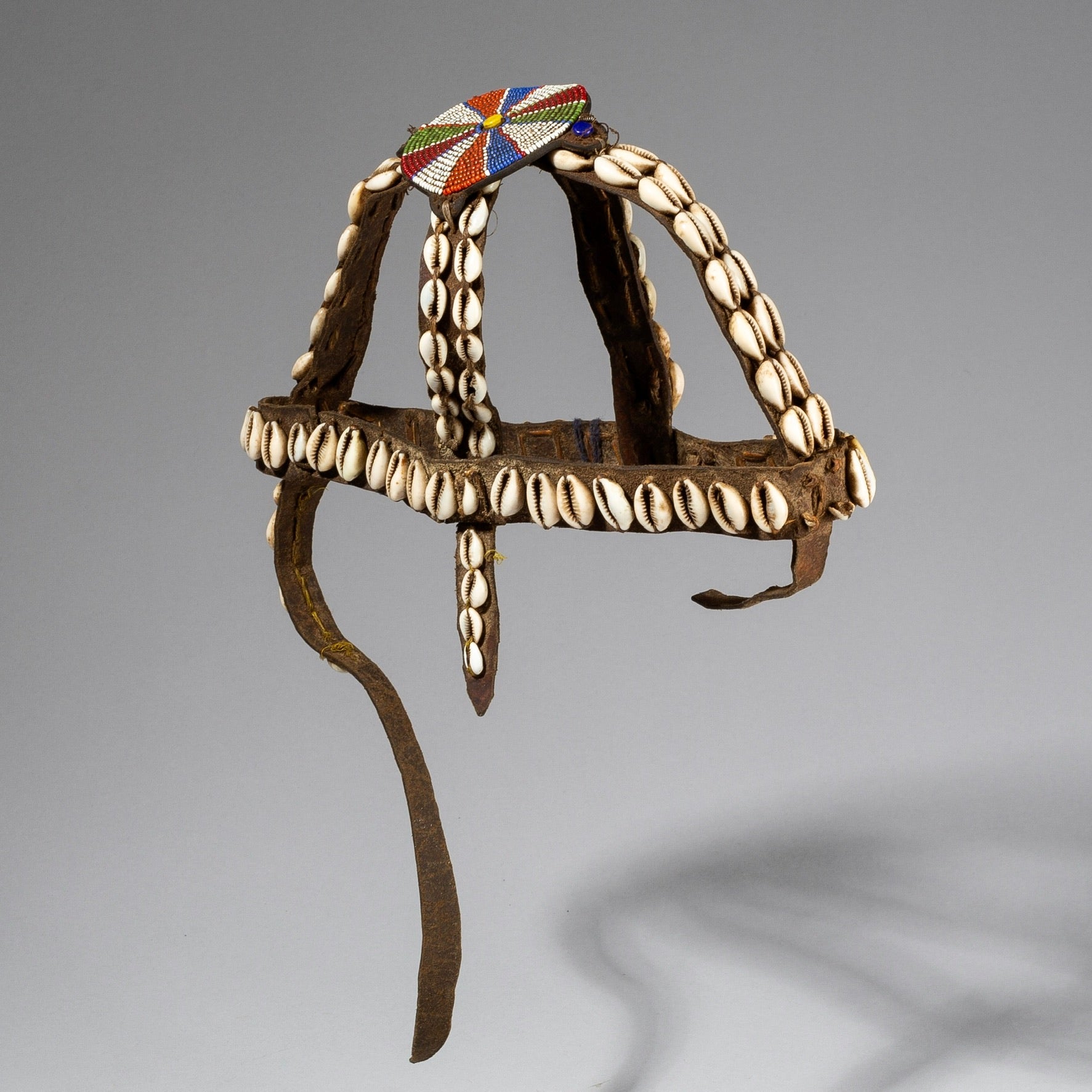 A LEATHER, SHELL, + GLASS TRADE BEAD HEADDRESS FROM KENYA ( No 583 )