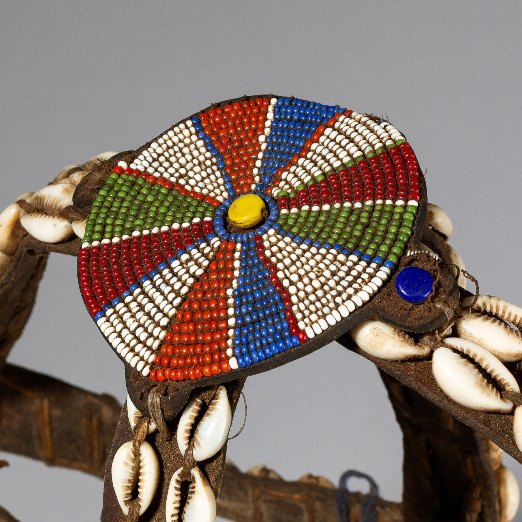 A LEATHER, SHELL, + GLASS TRADE BEAD HEADDRESS FROM KENYA ( No 583 )